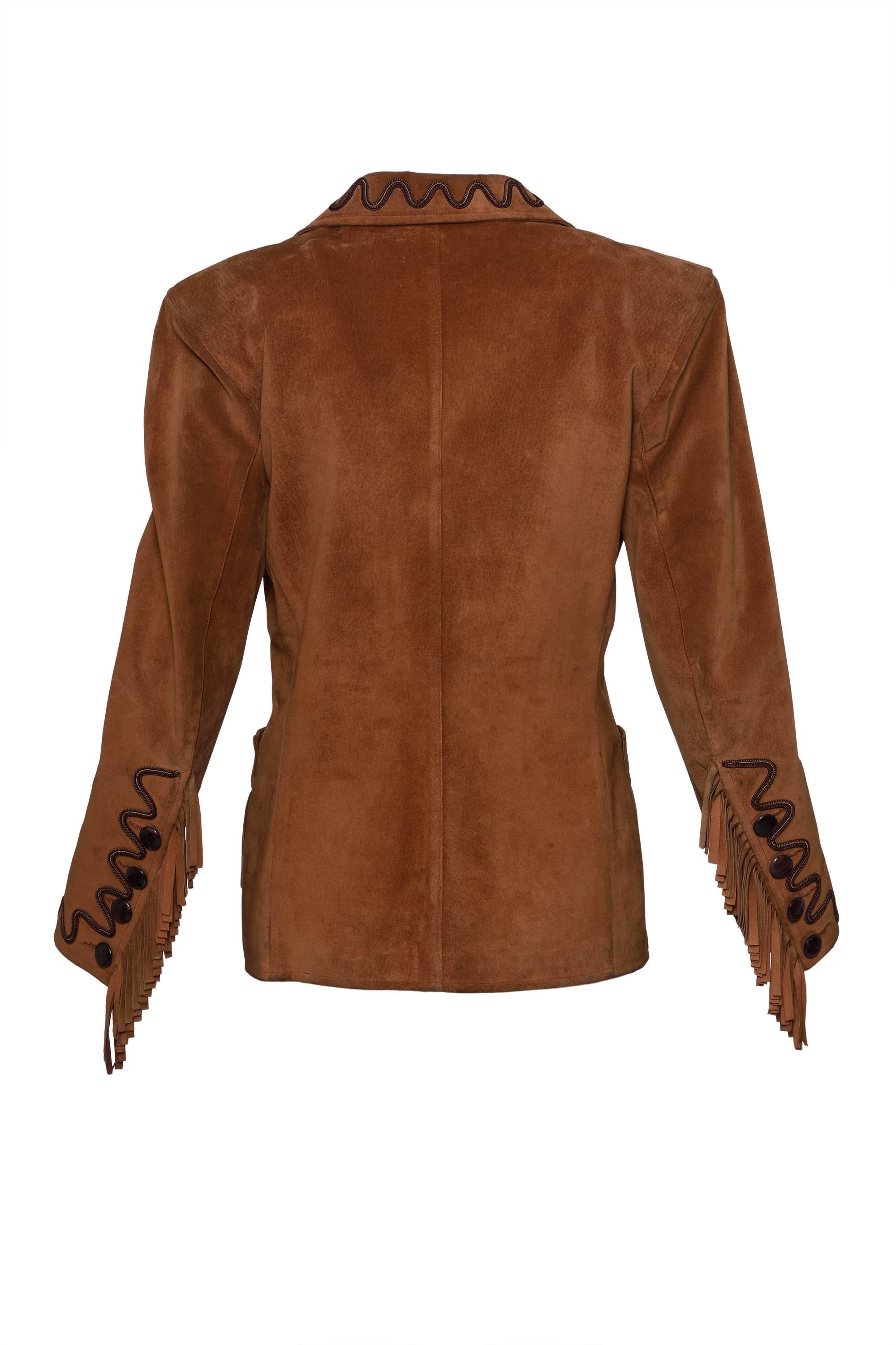 This lovely Yves Saint Laurent jacket is in a brown suede soft leather with trimming and fringe details. It has buttons frontal closure and pockets. It's fully satin lined.

Good condition 

Label: Yves Saint Laurent Rive Gauche - Made in