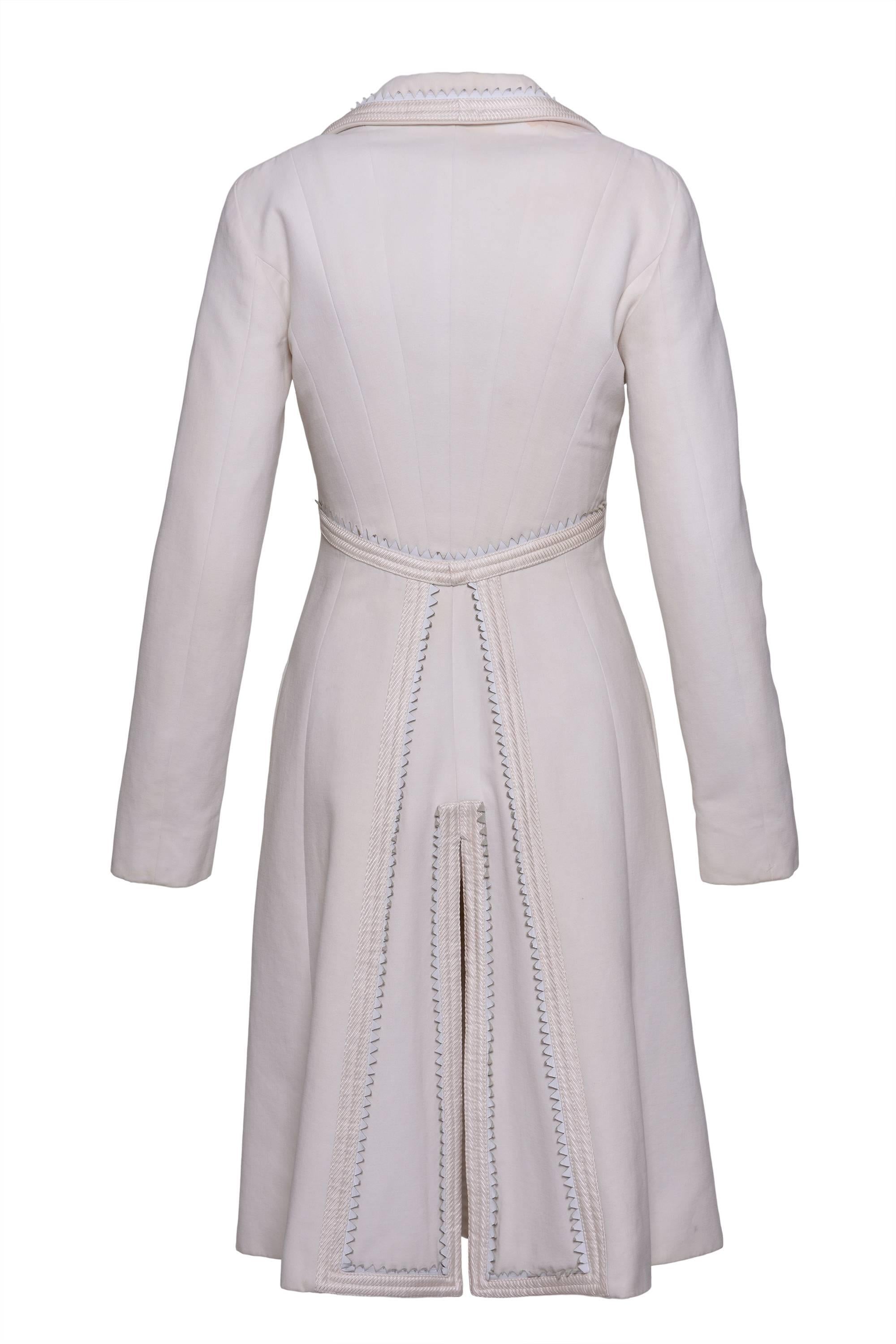 This gorgeous 1990s GIANNI VERSACE Couture white coat is in gabardine wool fabric whit trimming satin and leather white details. It has snaps and hooks closure and is fully logo satin lined.

Good Vintage Condition 

Label: Gianni Versace Couture -