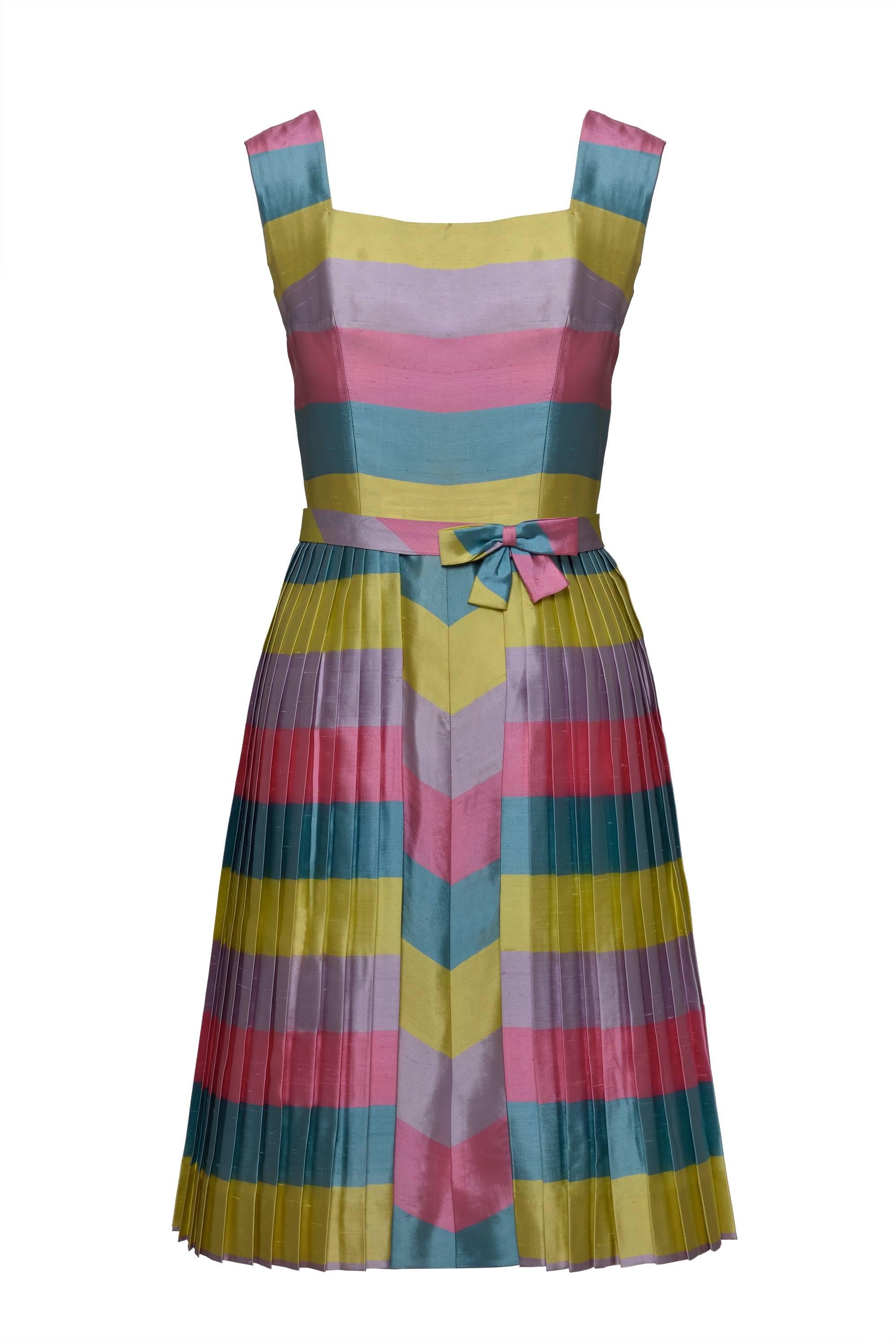 This gorgeous italian tailor 1950s cocktail dress with bolero jacket and belt is in pastel color striped print shantung fabric. The dress has back zip and hook and eye closure. The jacket has button closure and the belt has a bow with a hooks and