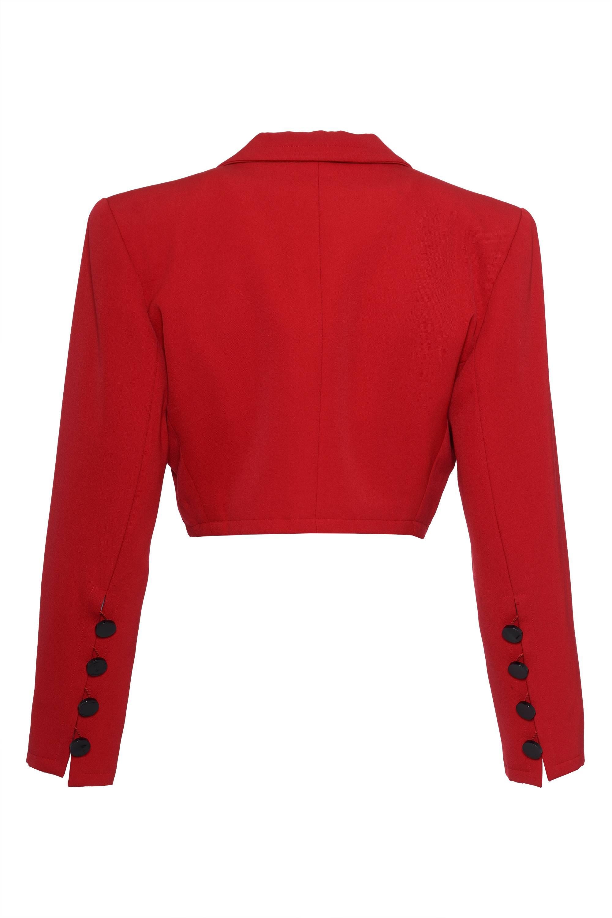 1990s YVES SAINT LAURENT 
This red bolero jacket by Yves Saint Laurent has two frontal welt pockets, tailoring seam, round collar peak lapel, two-piece sleeves and has long buttoned cuff.

Excellent vintage condition

Label: YVES SAINT LAURENT Rive