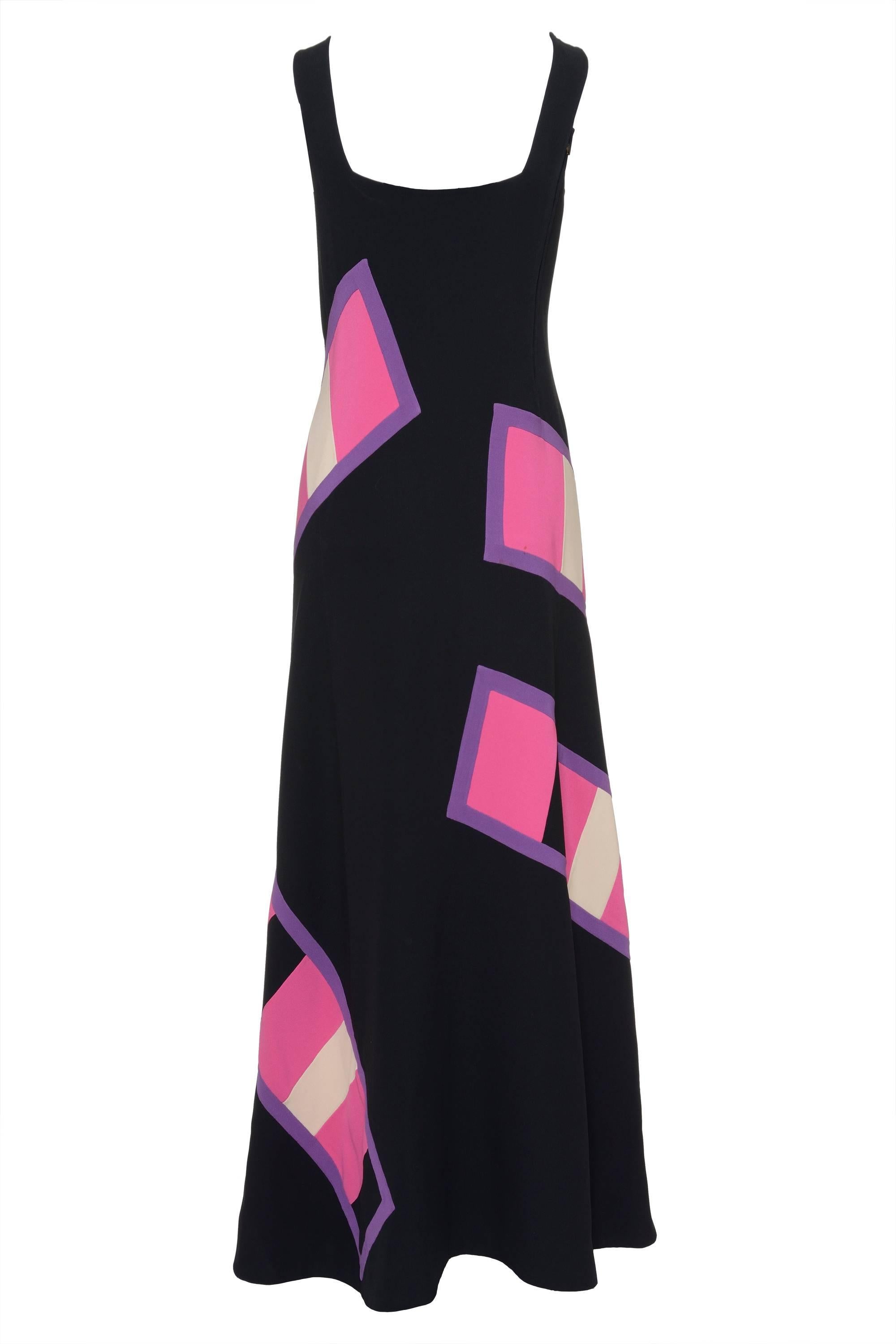 This lovely 1970s Long Dress by MILA SCHÖN is Black with rectangular Patchwork details purple and white fuchsia pattern crossing, A-line skirt, front boat and back square neckline, armhole princess seams, with hook and eye closure on the shoulder,