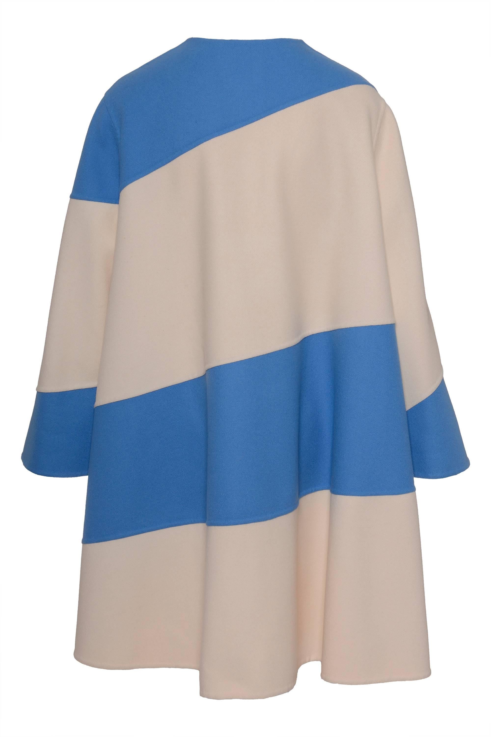 This lovely White and sky blue patchwork tent coat by LAURA BIAGIOTTI has a lined button closure, angel sleeves, pad shoulders. It is a piece of a special futurist collection inspired by the artist Giacomo Balla, in addition this item has been