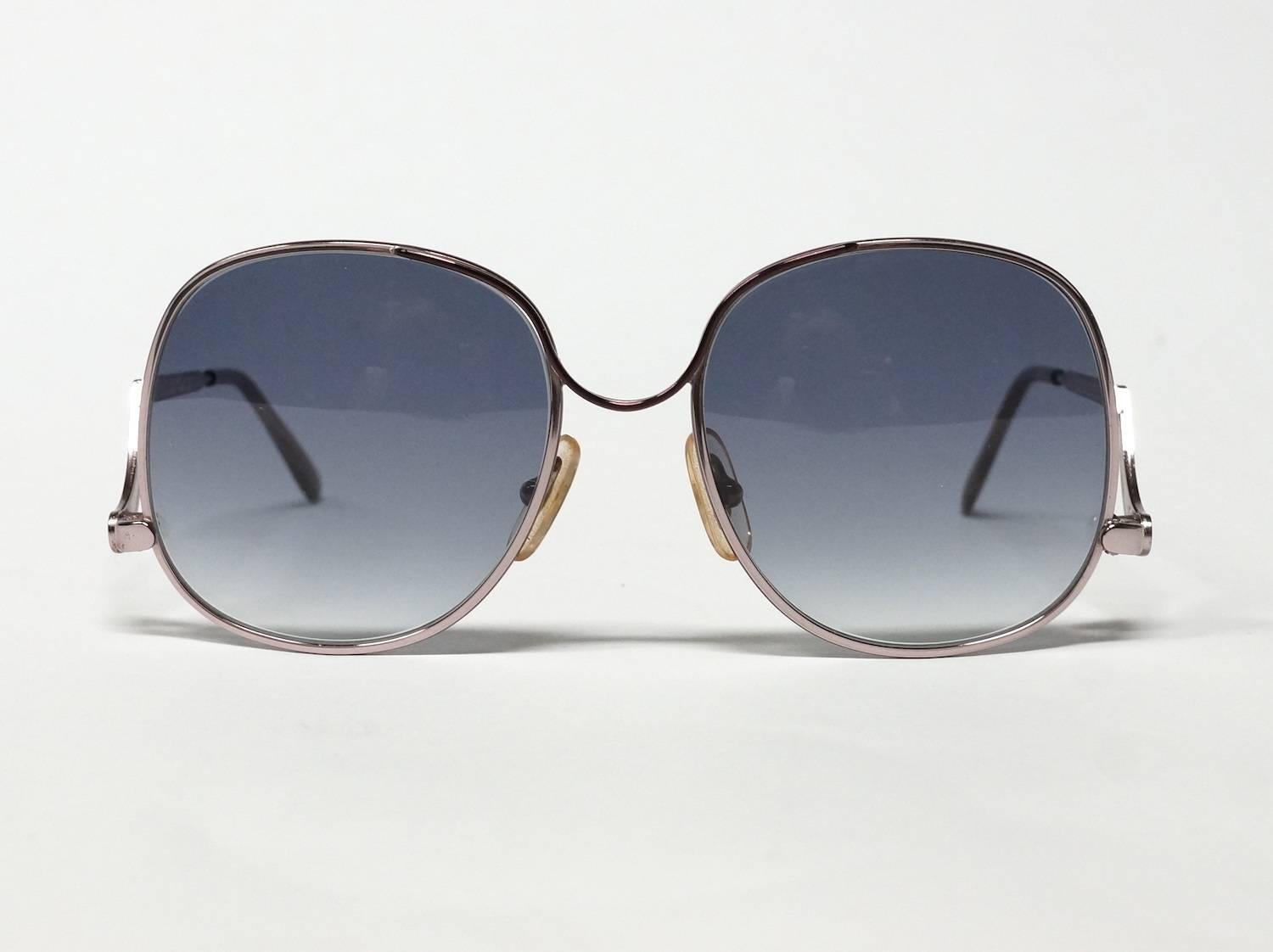 1990s oversized vintage sunglasses by Robert Claude Paris. High quality oversized rose gold metal optical frame with darker accents and stunning low placed swinging temples. 

Model: 4005
size: 54▢20 -140 

approximate dimensions: 
temple