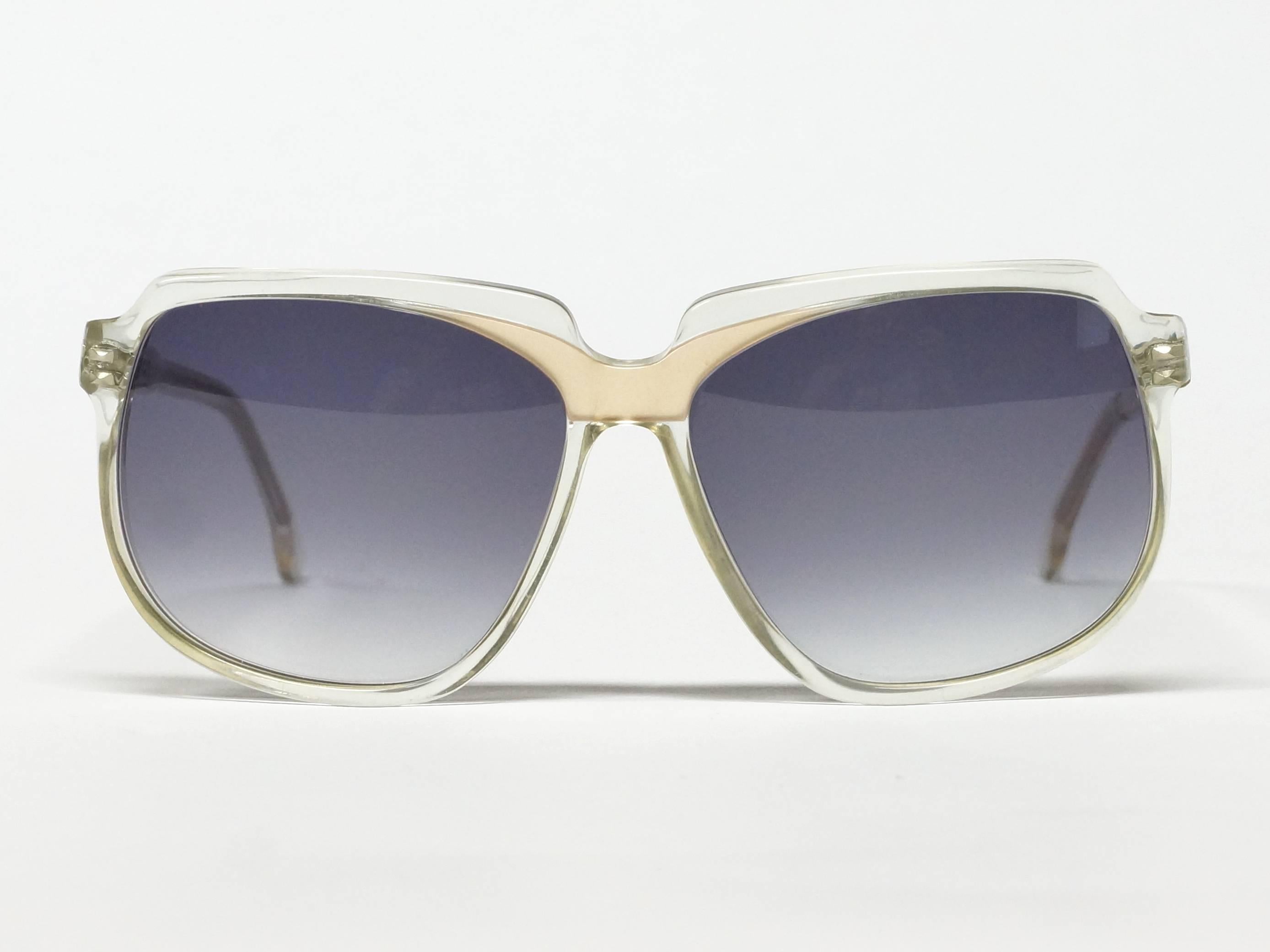 1980s French vintage sunglasses by Charles Jourdan. Clear lucite frame with gold colored highlights. 

model: CJ13
size: 53▢17-140

approximate dimensions:
temple length: 140mm - 5 1/2