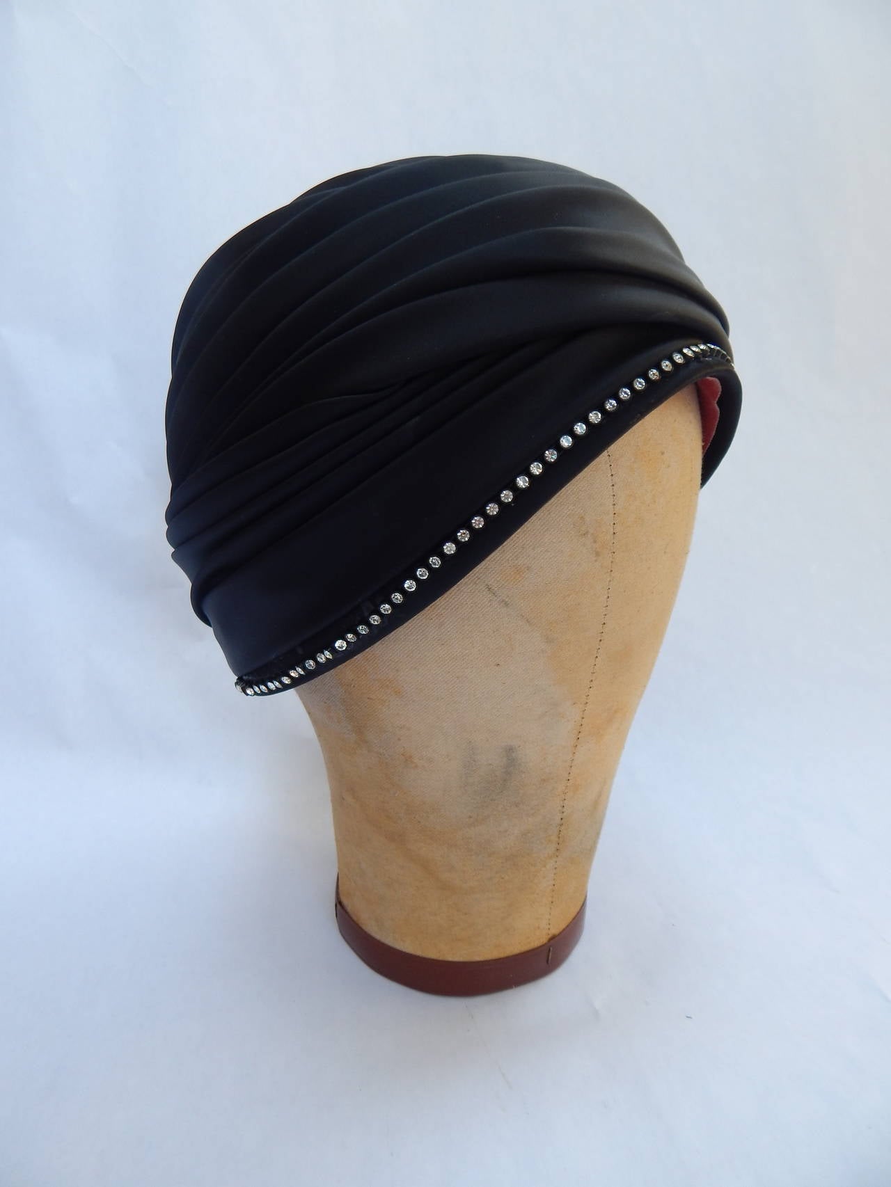 Black Adolfo Silk Turban style hat with rhinestones.