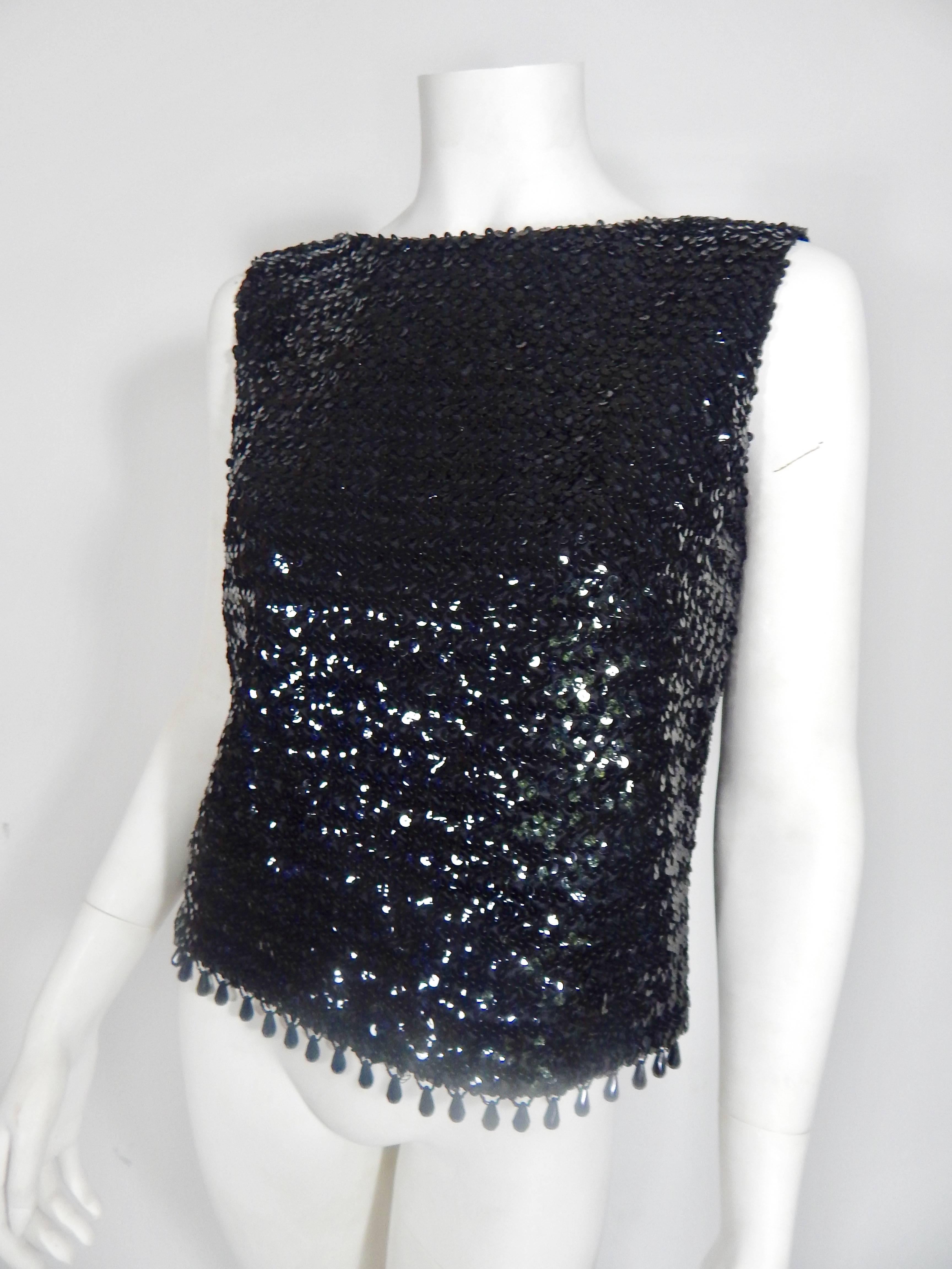 Late 1950s / Early 1960s Sequin Evening Top. Fringe Beading on bottom. Interior and Exterior in Excellent Condition. Fully lined in black. Bust size 36. 
