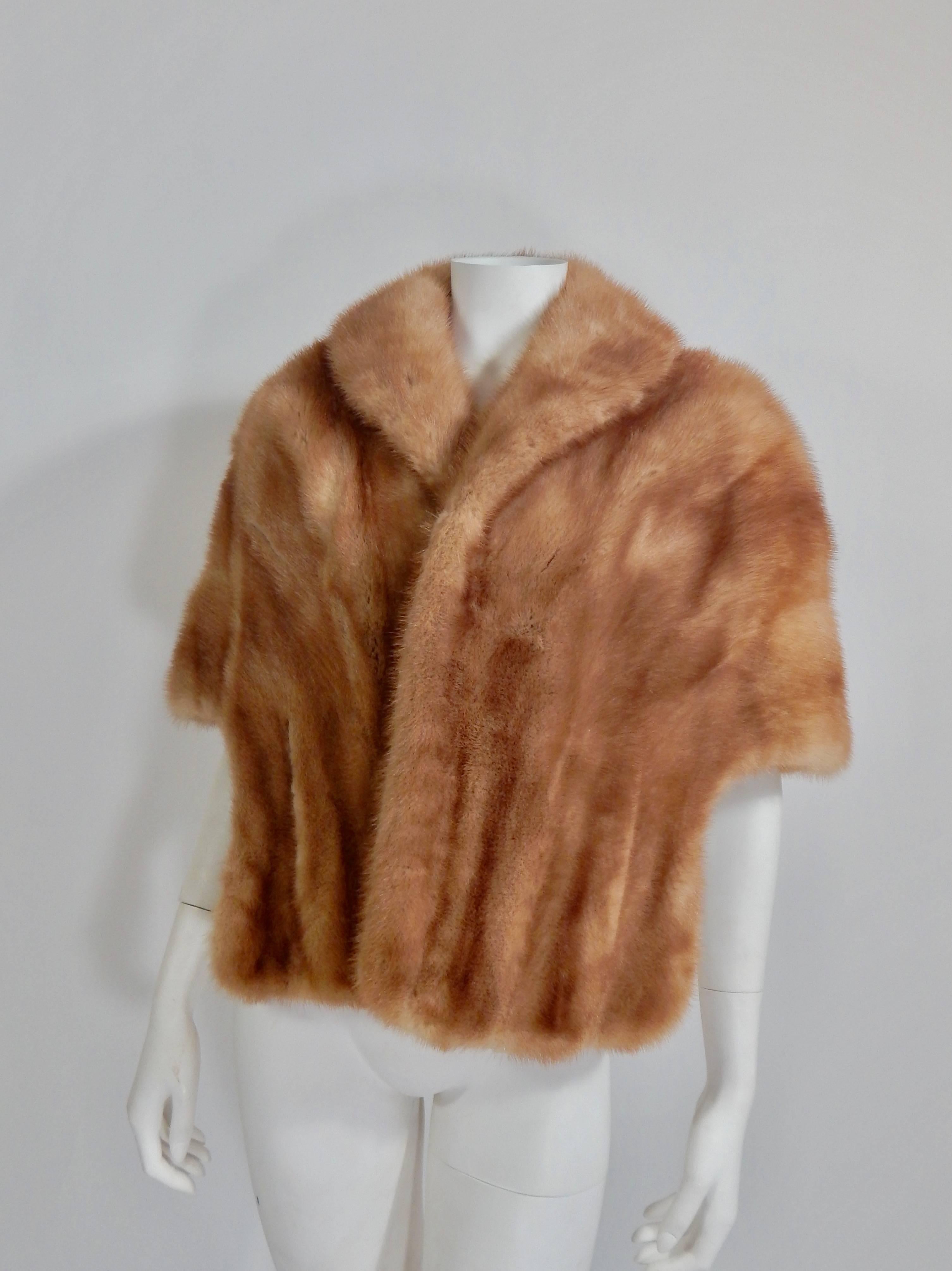 Gorgeous 1950s / 1960s Mink Stole by Evans, Paris Milan Chicago. Hand Pockets. Fully lined in silk. Embroidered on the inside lining where there is usually a name or monogram is the Spanish word Chiquita which means, baby, honey, doll, etc. 
Size