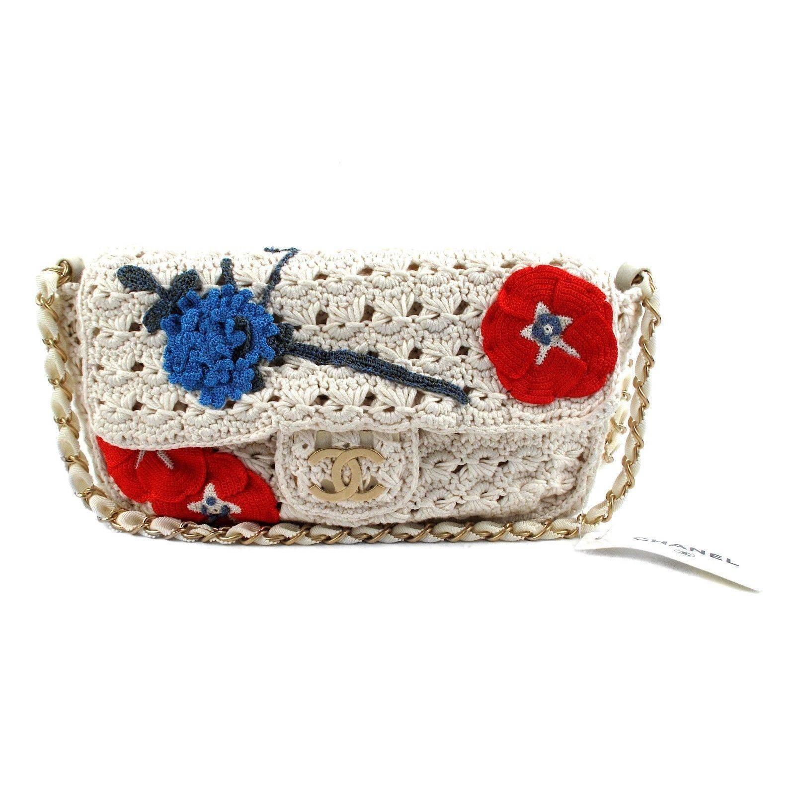 Brand NEW!

Chanel - Crocheted Knit Camellia Runway Bag

Retail: $4500.00

Color: White / Red / Blue

Material: Fabric - Suede

------------------------------------------------------------

Details:

- embroidered camellias