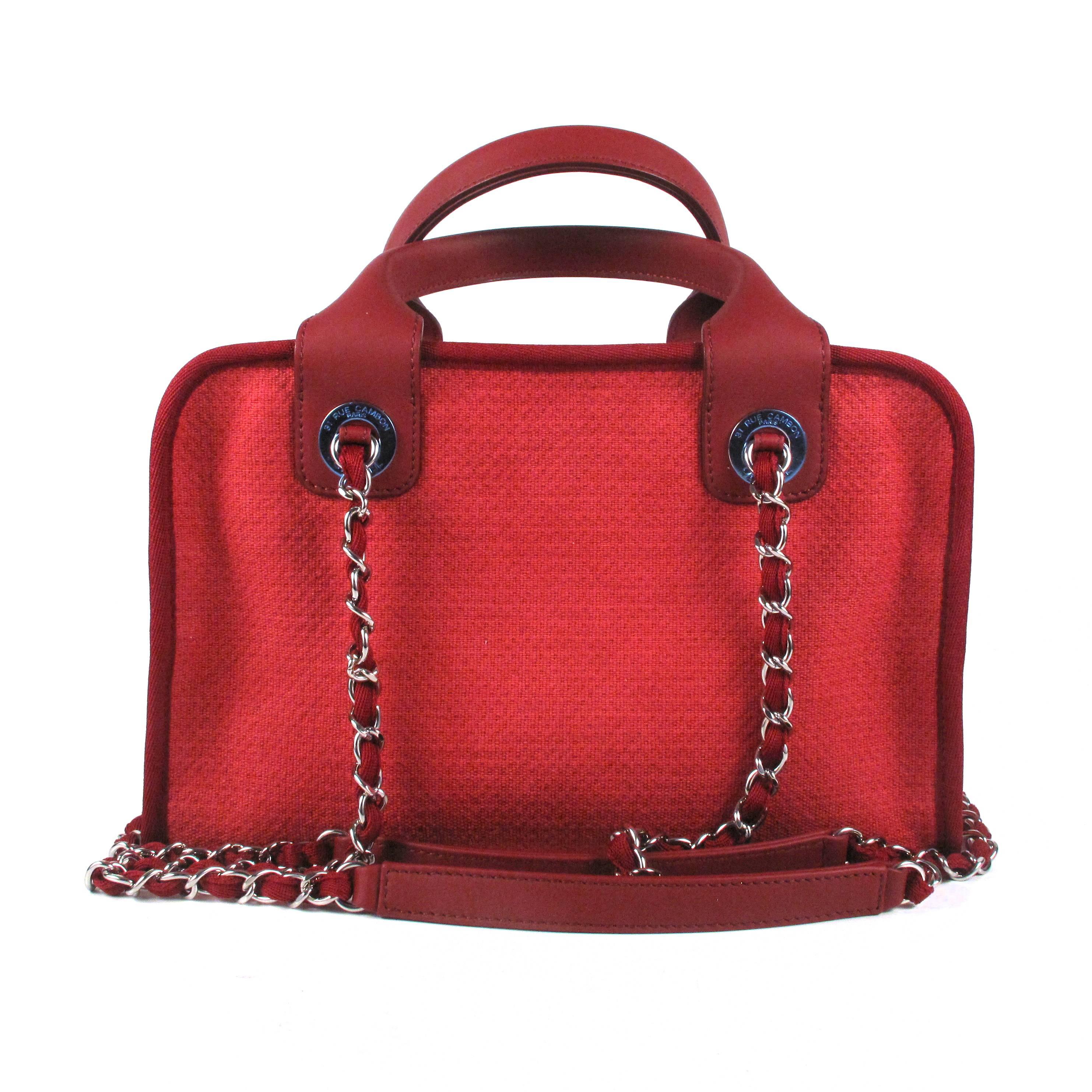 Chanel - Deauville Bowling Bag

Color: Red

Material: Canvas & Leather

------------------------------------------------------------

Details:

- silver tone hardware

- dual shoulder chain straps

- dual rolled leather handles

- CC