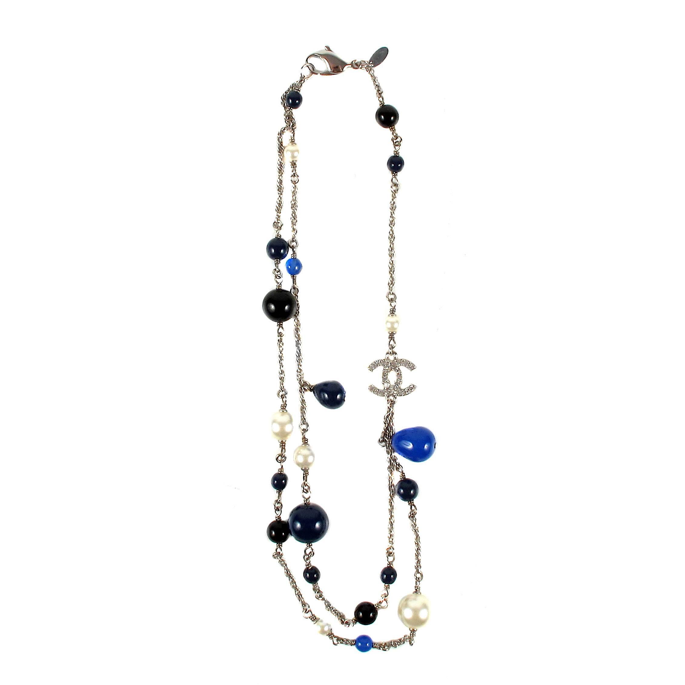 Chanel - Pearl Crystal Necklace

Color: Blue / Black / Silver

Material: Metal / Pearl Beads / Crystal

------------------------------------------------------------

Details:

- silver tone hardware

- CC crystal rhinestone logo