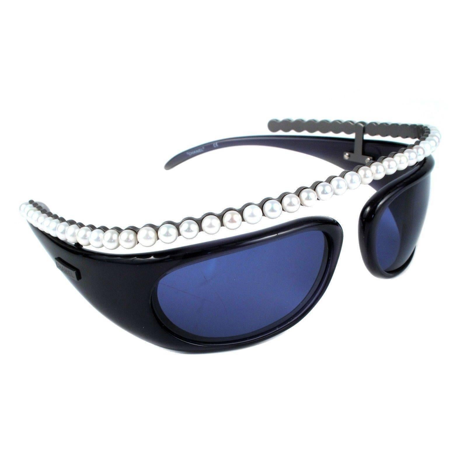 Chanel - Cutout Sunglasses

Color: Black / Blue / White

------------------------------------------------------------

Details:

- faux pearls along top of frames

- chanel logo at arms

- includes dust bag & box

- item #
