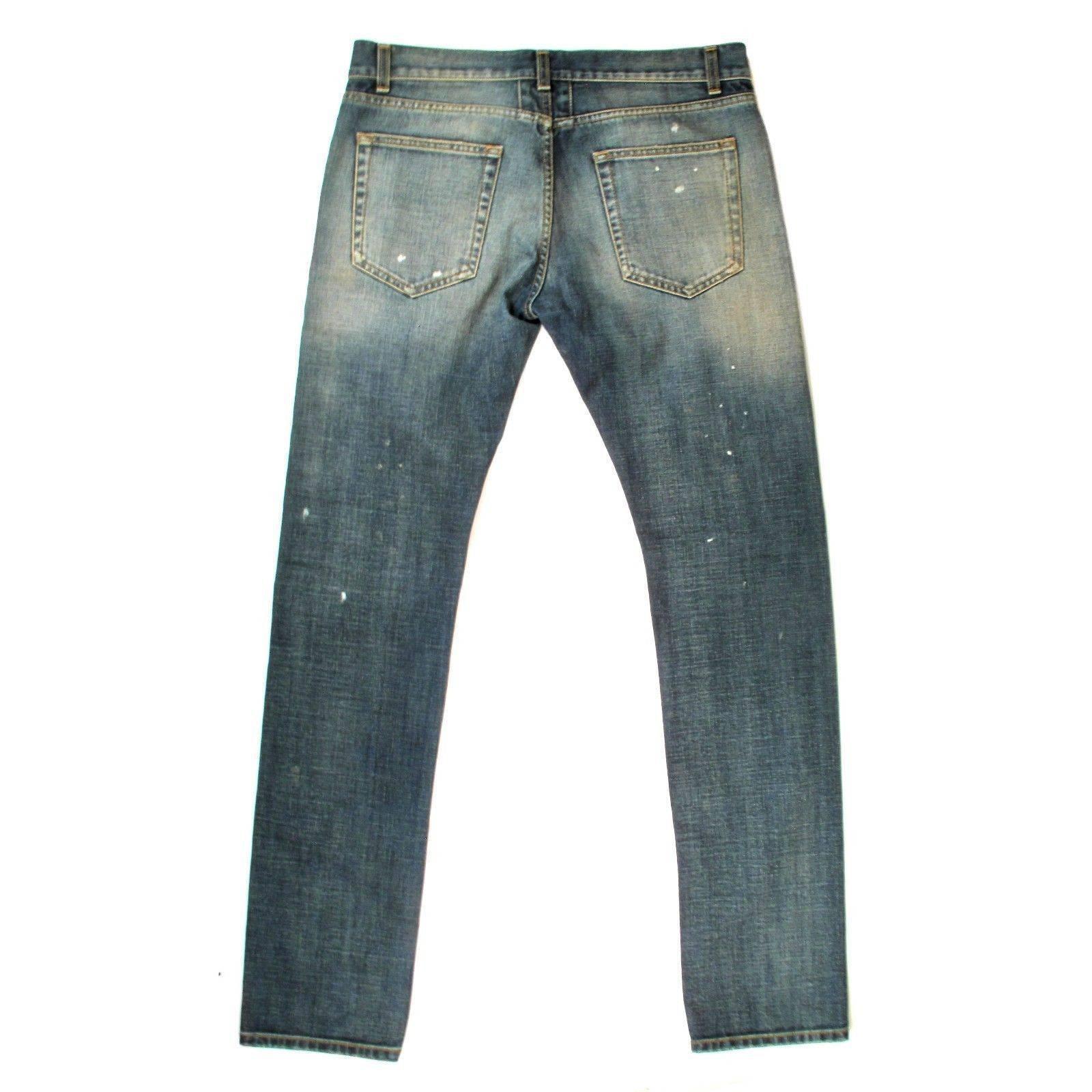 Saint Laurent - Men's Denim Jeans
 
Size: 32

Color: Medium Blue

Material: 100% Cotton

------------------------------------------------------------

Details:

- rip & paint details

- distressed dirty wash

- straight leg

-