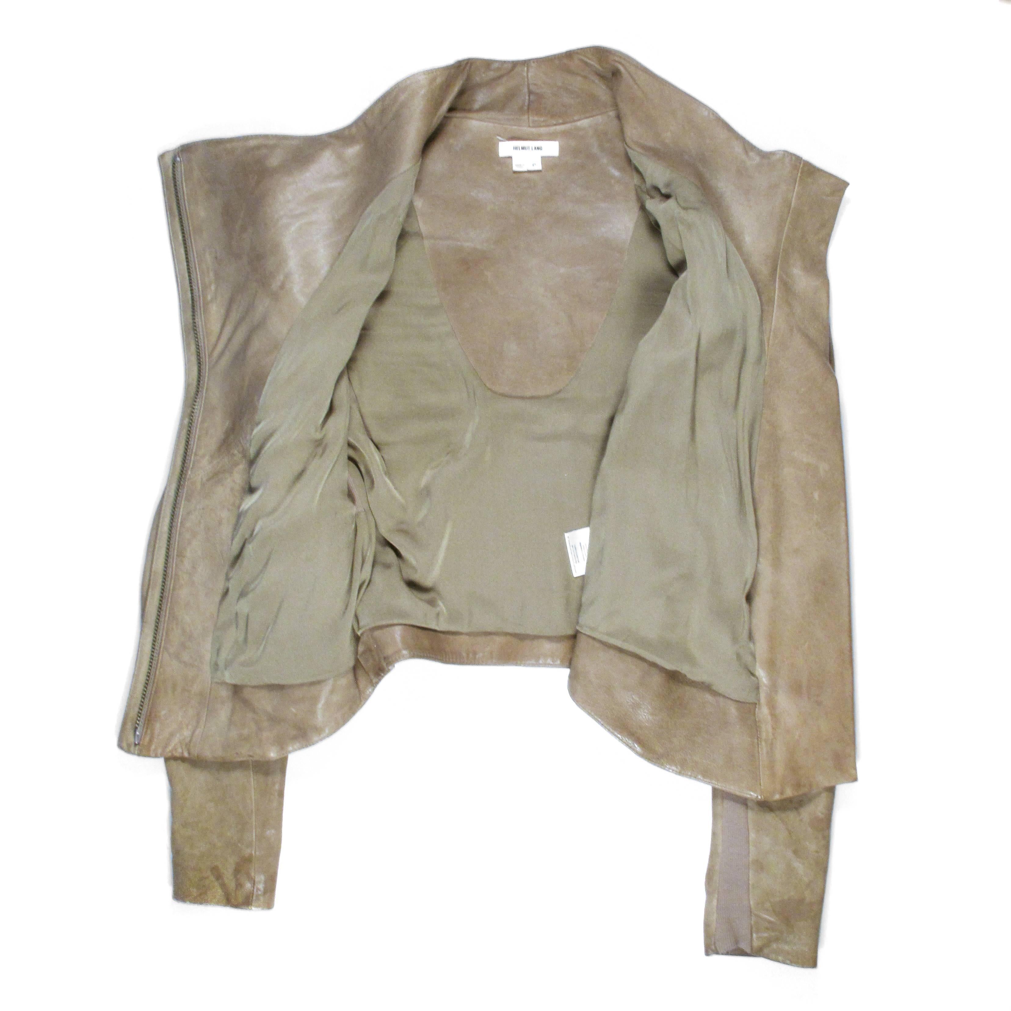 Helmut Lang - Leather Jacket

Retail: $1500.00

Size:  Small

Color: Tan

Material:  Leather

------------------------------------------------------------

Details:

- hidden zip closure

- ribbed trim

- silver tone hardware

-