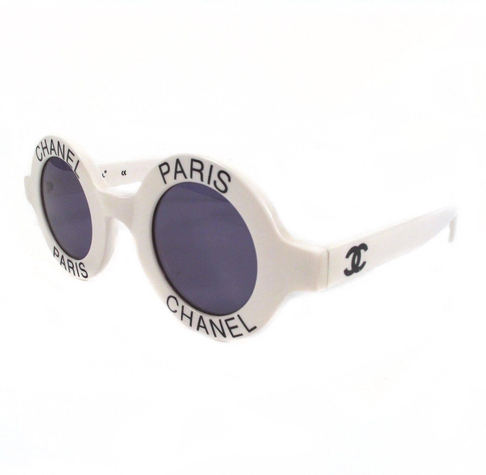 Chanel - Vintage White Round Logo Sunglasses

Color: White & Black

------------------------------------------------------------

Details:

- round frame lenses

- CC logos at temples

- item # AA1375

Condition: Great condition -