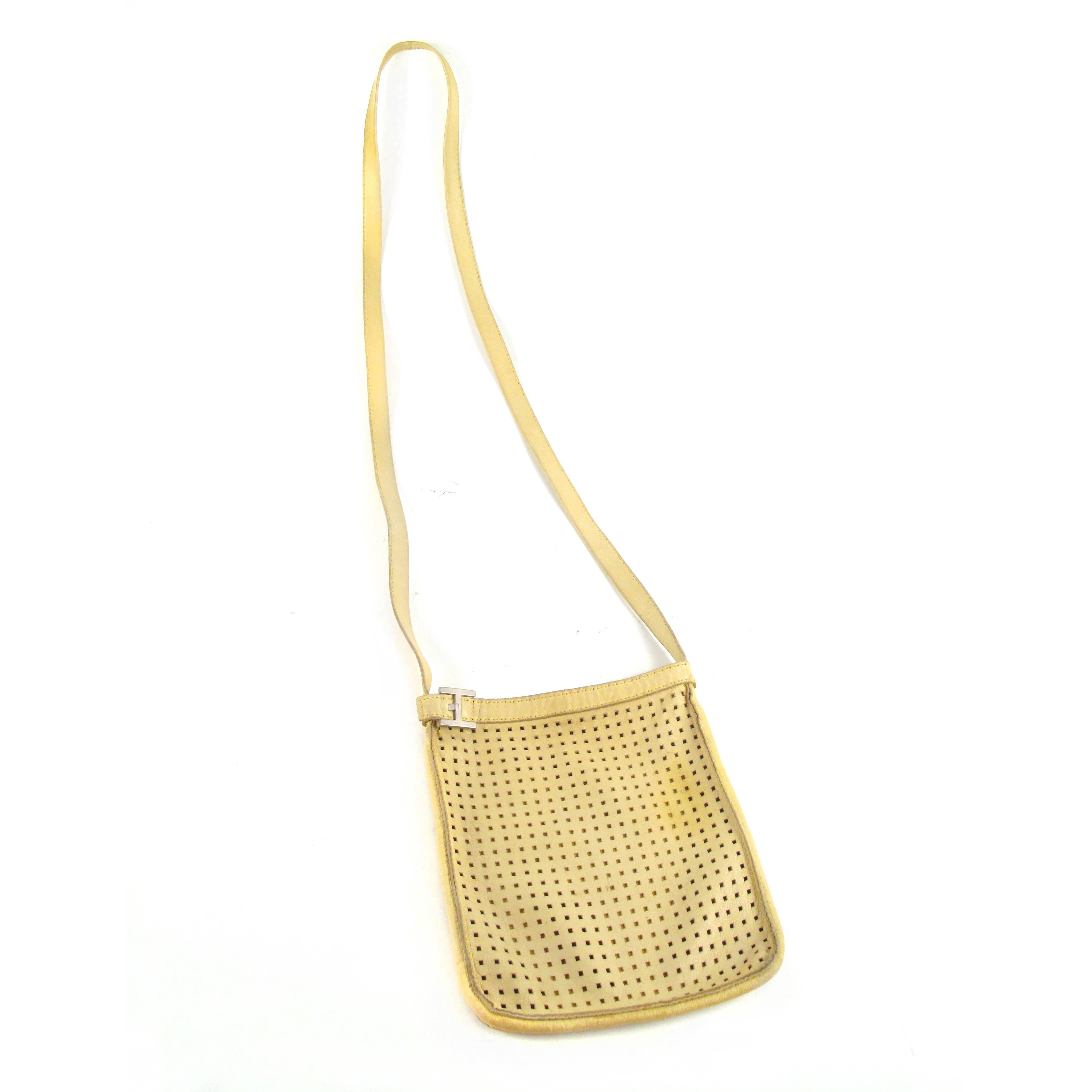 Hermes - Small Perforated Crossbody Bag

Color: Yellow

Material: Leather

------------------------------------------------------------

Details:

- silver tone hardware

- perforated leather at front

- includes hermes box

- item #