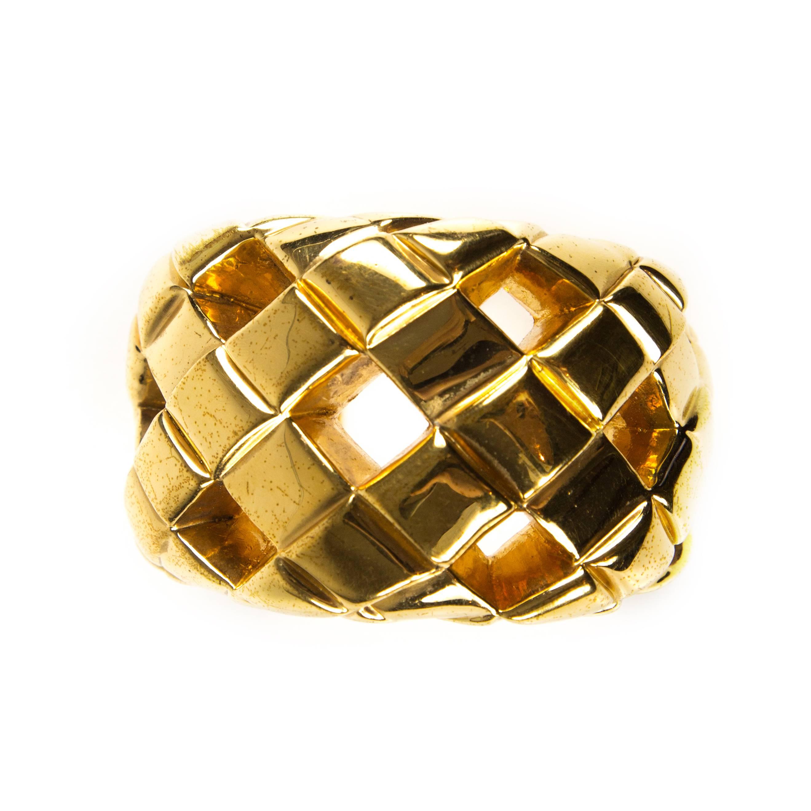Chanel - Rare Cut Out Vintage Cuff Bracelet

Color: Gold

Material: Metal

------------------------------------------------------------
 
Details:

- quilted / woven metal pattern

- diamond cut outs throughout

- gond-tone