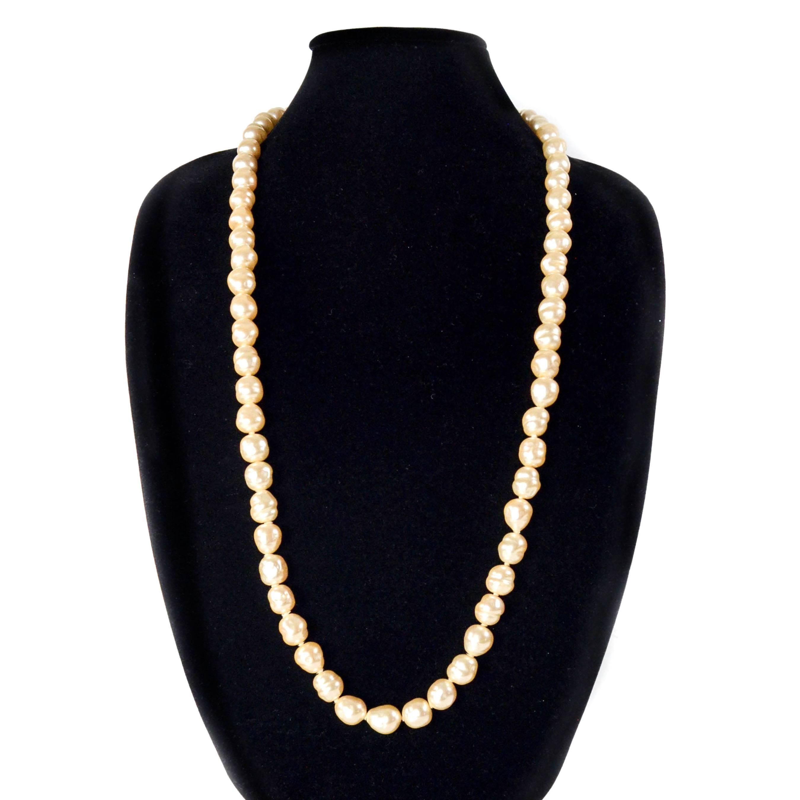 Chanel - Pearl Long Vintage Necklace

Color: White

Material: Pearl Beads

------------------------------------------------------------

Details:

- gold tone hardware

- can be worn single or double wrapped around neck

- stamped 1981

- item