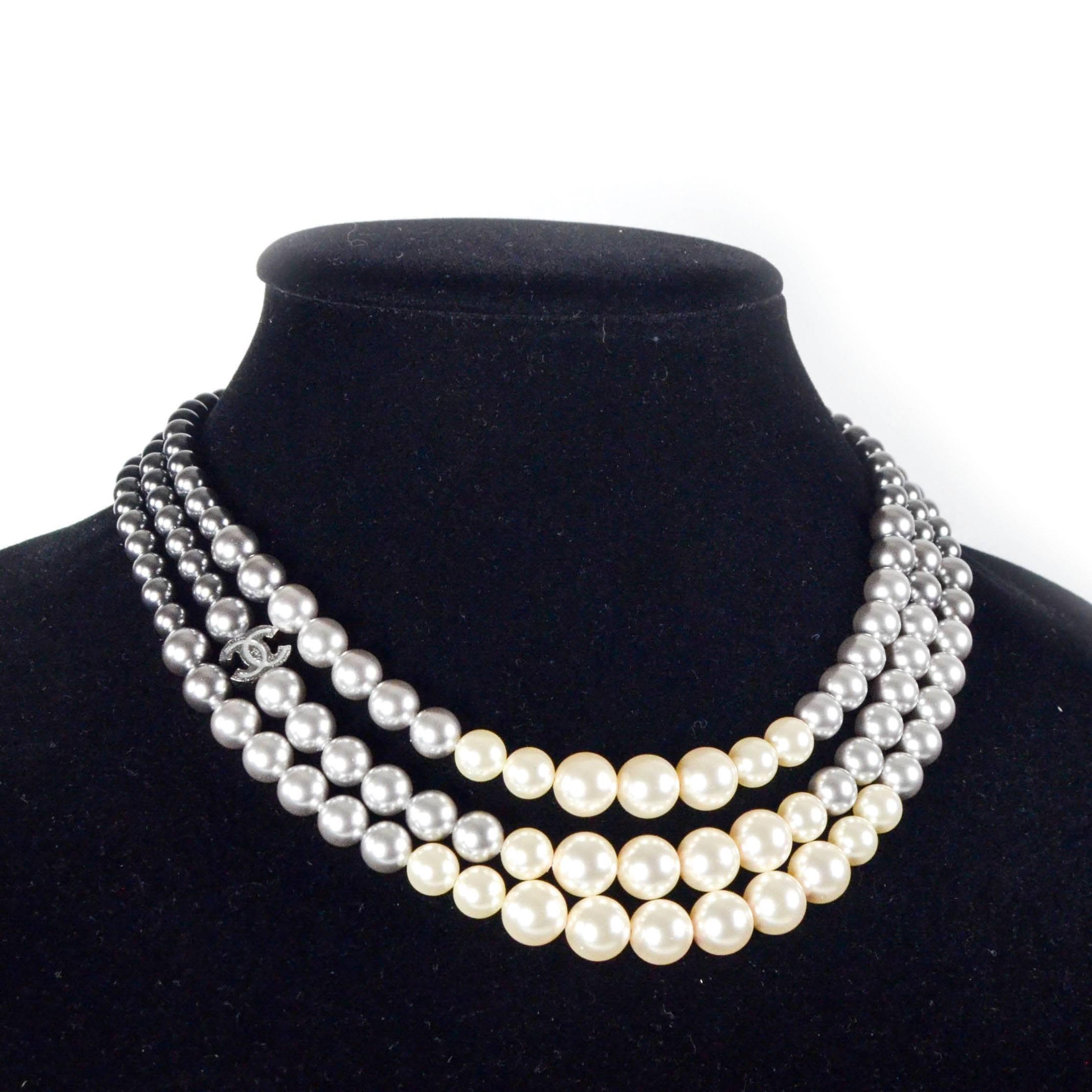 Chanel - Pearl Ombre Multistrand Gradient Necklace 

Color: Silver / Gray / White
 
Material: Pearl Beads
 
------------------------------------------------------------
 
Details:
 
- silver tone hardware

- 3 strands

- dark gray to white ombre