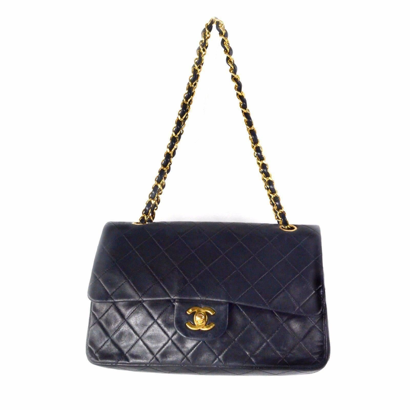 Chanel - Medium Lambskin Leather Double Flap Bag

Color: Black

Material: Lambskin Leather

------------------------------------------------------------

Details:

- can be worn single or double strap on shoudler

- gold tone hardware

- CC turnlock