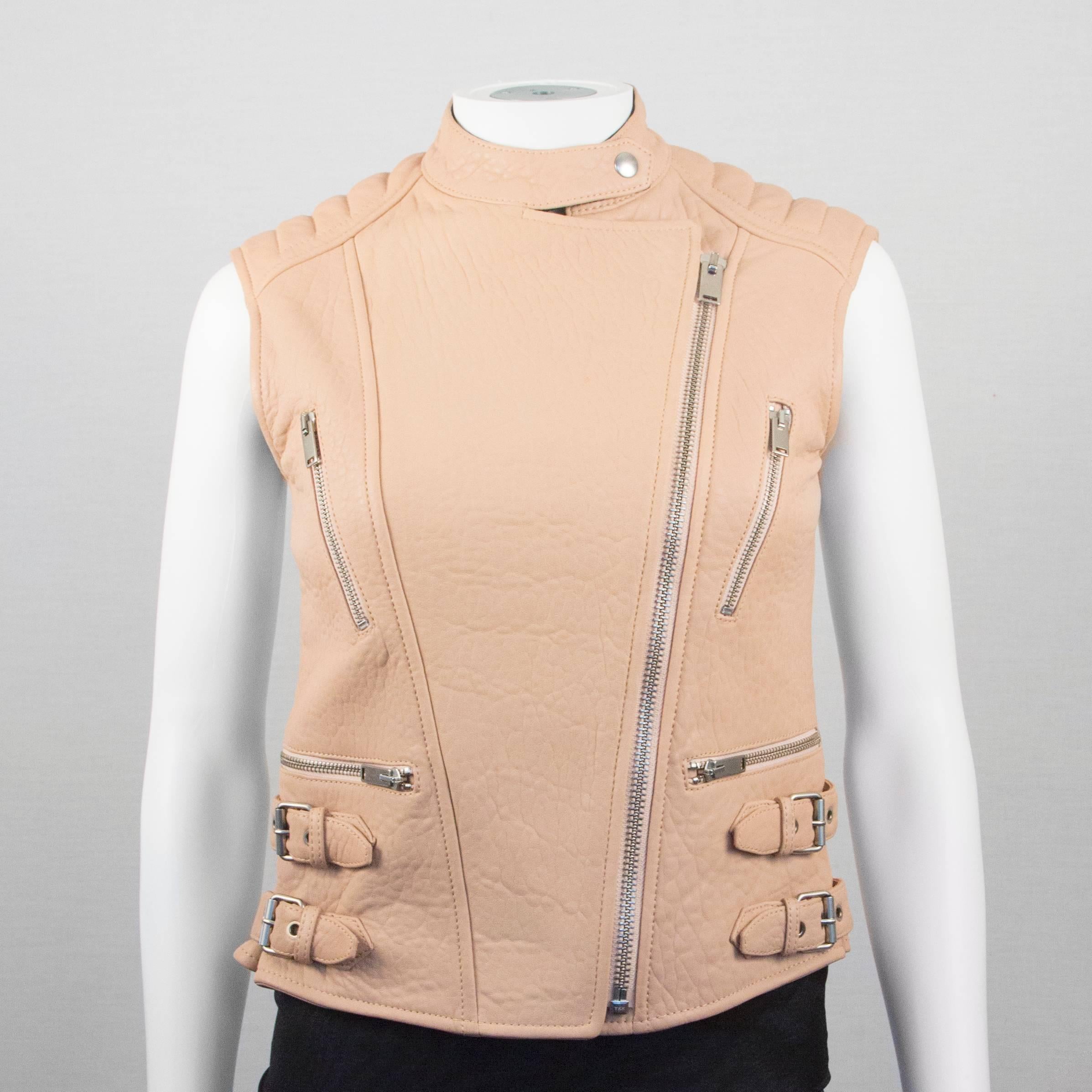 Brand New:

Celine - Tan Leather Biker Vest 

Estimated Retail: $6500.00 

Color: Tan

Material: Leather (Shell) - Viscose (Lining)

Size:  38 - US 4 / 6

------------------------------------------------------------

Details:

-