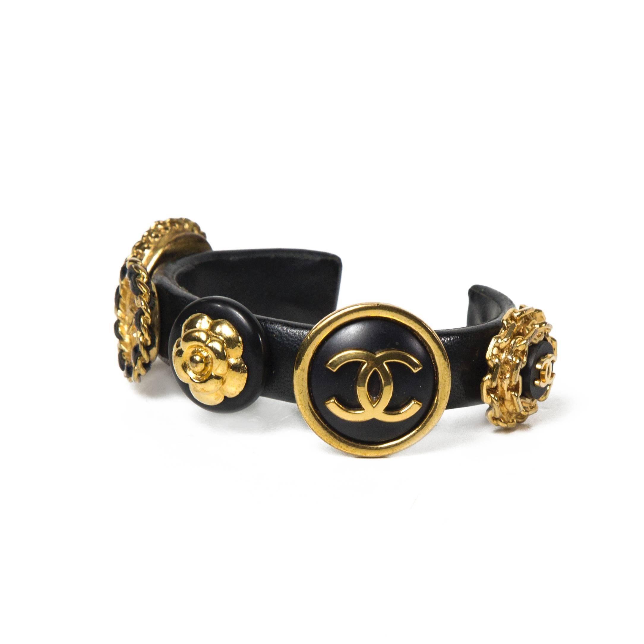 Chanel - 1980's Vintage Leather Charm Bracelet

Color: Gold / Black

Material: Metal / Leather

------------------------------------------------------------

Details:

- gold tone hardware

- CC medallion charms

- from collection 27 -