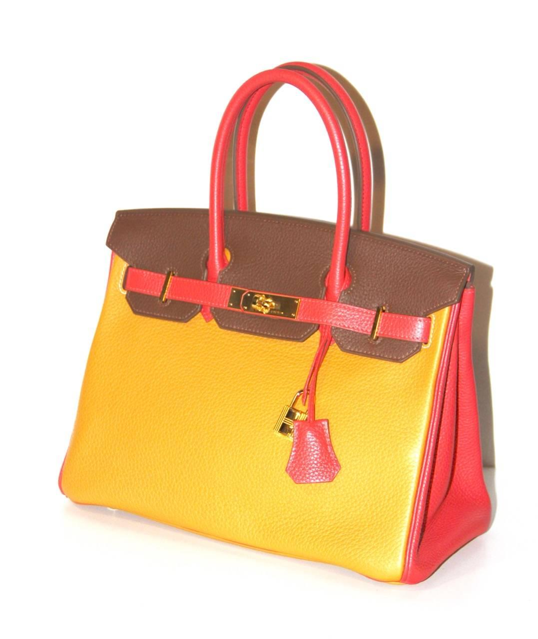 This is a Hermès Birkin HSS 30 CM bag that has been especially made to the specifications of a client.

Collection: 2013 
Leather: Togo
Color: Hermès Pink Bougainvillea, Hermès Yellow Moutarde, Hermès Brown Terre
Hardware: