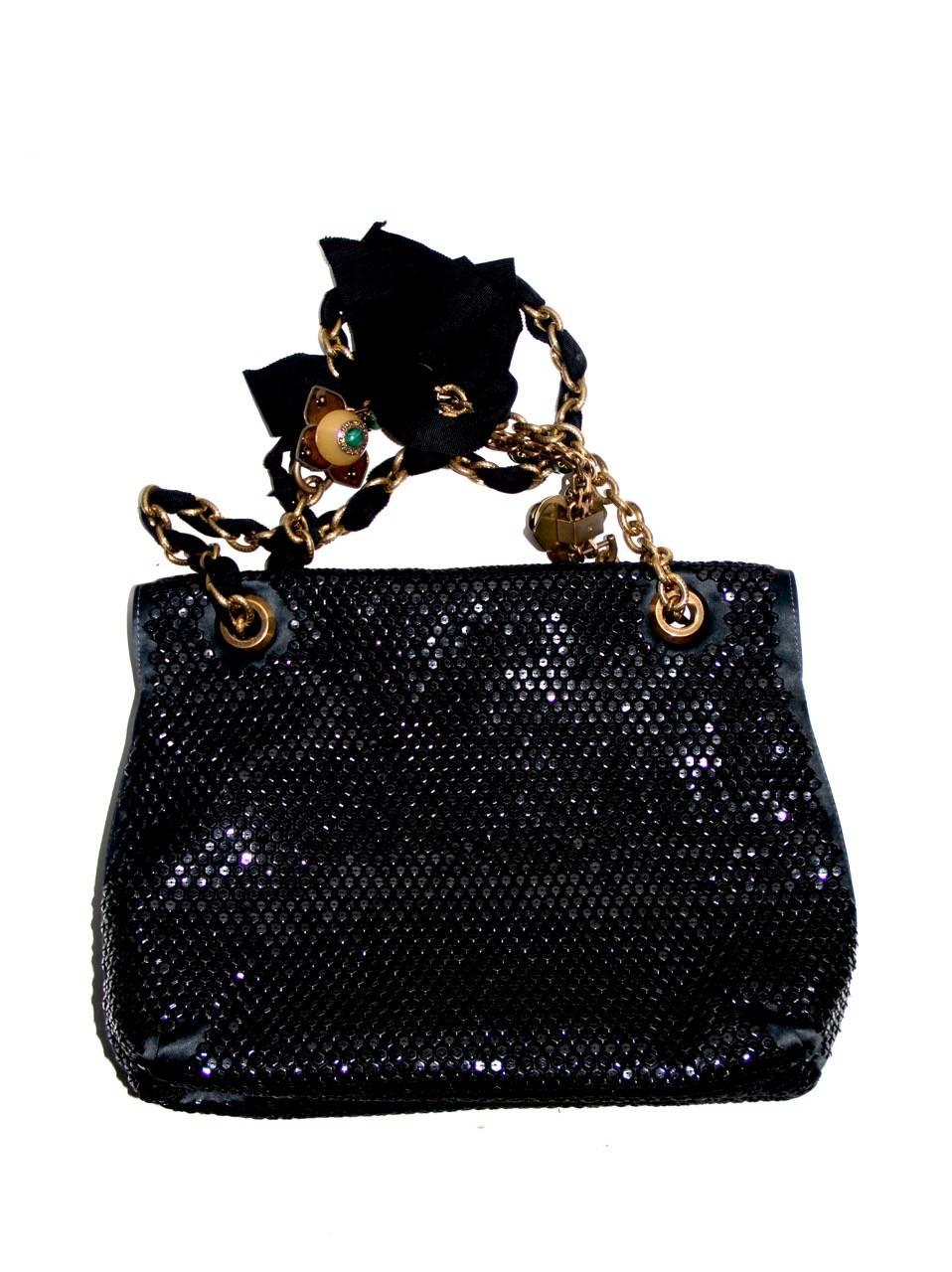 Amazing and sophisticated Lanvin bag that highlights the brand's refined style. Released in 2012 for the Alber Elbaz's tenth anniversary as designer at Lanvin. The bag features streamlined silhouettes and striking forms. Beaded, black sequins and