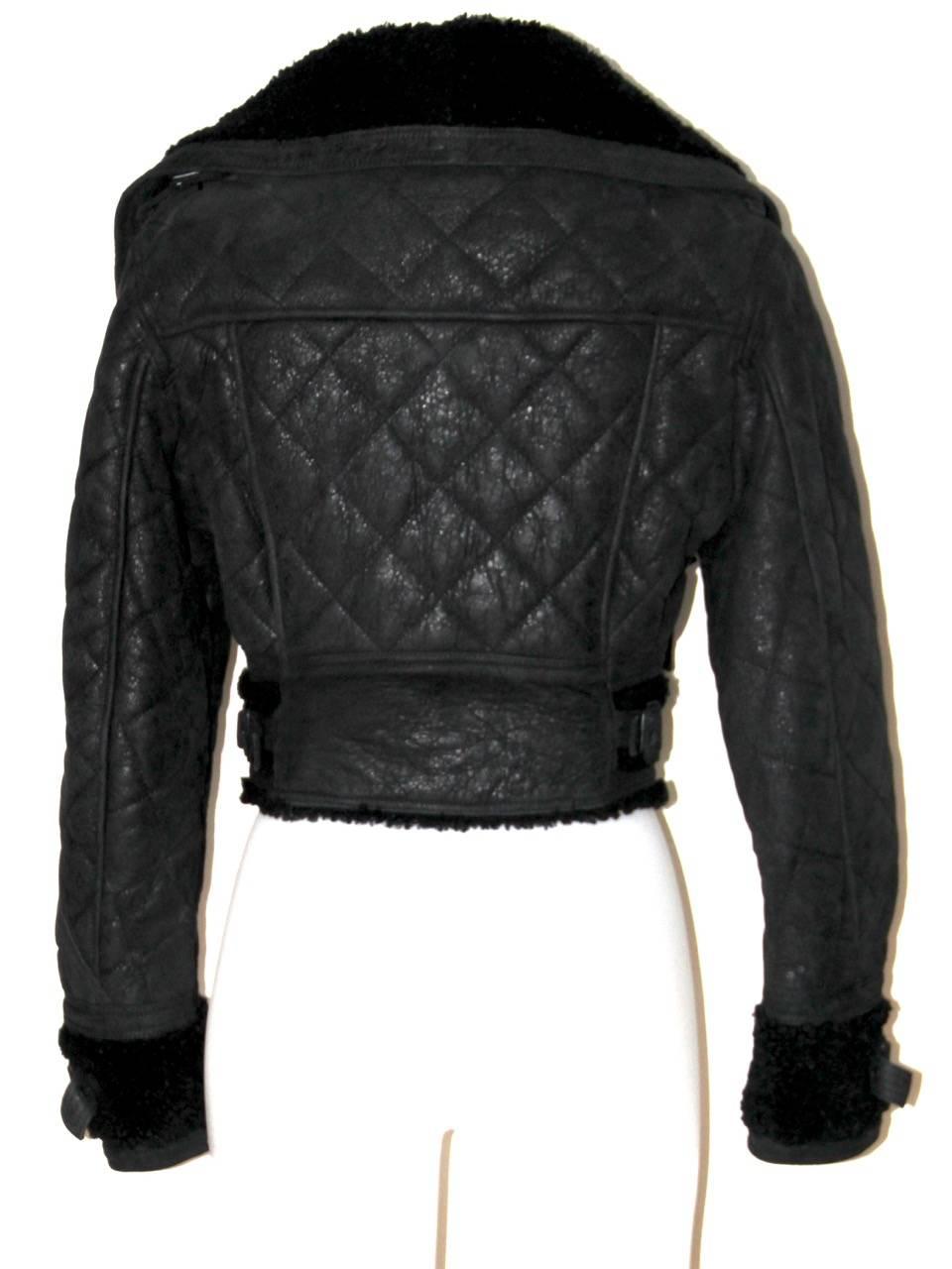 Signature Aviator Jacket by Burberry. Masterpiece from the fall-winter 2010/11 runway collection. All black, very rare. The leather has been tumbled to create a broken vintage effect

Collection: Winter 2010/11
Fabric: Quilted Shearling