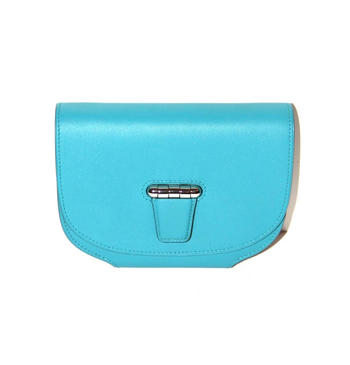 The Micro Convoyeur is a wallet with a removable shoulder strap and is inspired by the Convoyeur bag from the Fall 2013 collection. 

Collection: 2014
Leather: Swift
Color: Turquoise Blue
Hardware: Palladium
Measurements: Length 11.5 cm x Height 15