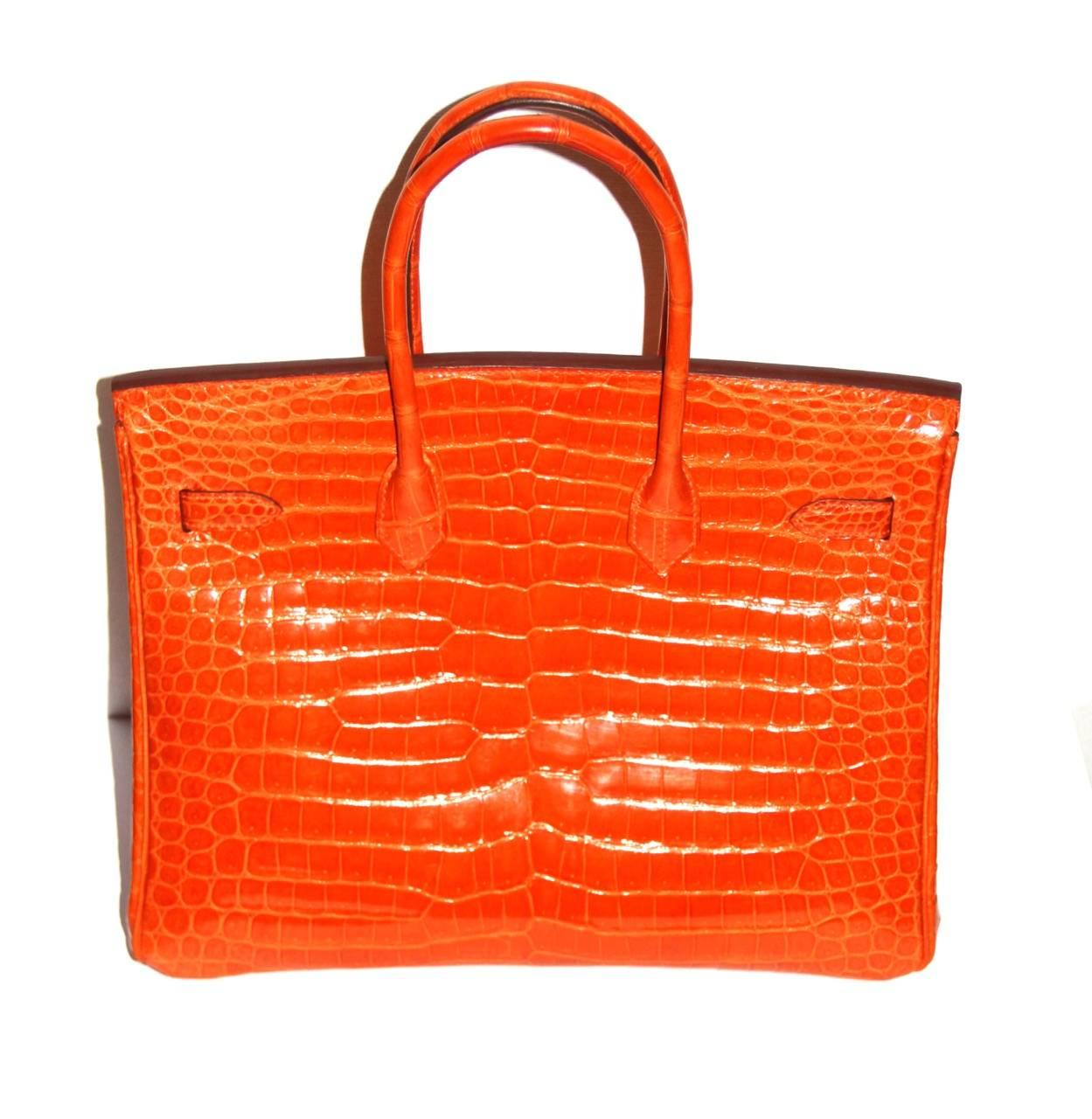 Amazing Birkin bag from Hermes, gorgeous Potiron Orange color. 
In excellent condition with CITES, box and dust bag. 

Collection: 2009
Leather: Crocodile Porosus
Color: Potiron Orange
Hardware: Palladium
Interior: tonal color, one zip