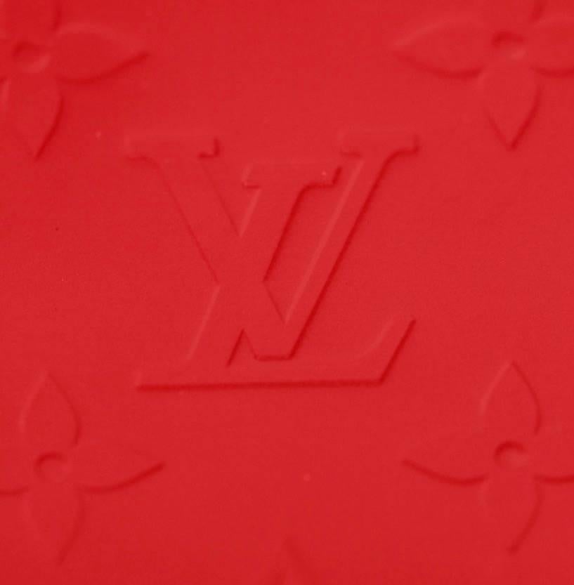 Limited edition Louis Vuitton bag from the Fall 2003 collection. Crafted of red LV Monogram matte leather with red coated hardware. Featuring a flat top handle, a front zip pocket, a snap push closure and a fully lined interior with one slit pocket.