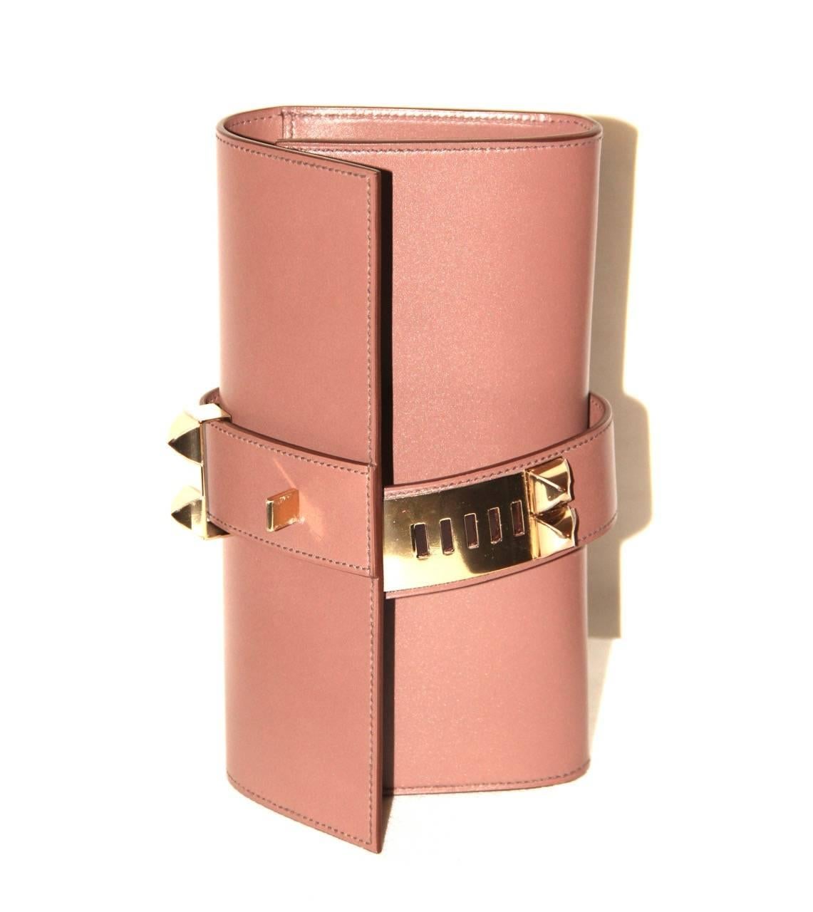 Signature style of Hermes. Sleek lines. Statement clutch  

Collection: 2014
Leather: Swift
Color: Rose Wood
Hardware: Pink gold-tone
Measurements: Length 23 cm x Height 12 cm x Width 4 cm 
Condition: Never worn
Come with: Dust bag, Hermes original