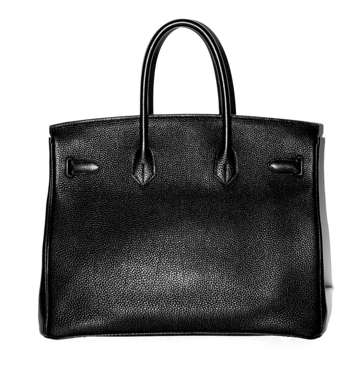 Collection: 2008
Leather: Togo
Color: Black
Hardware: Palladium
Measurements: L 35 cm x H 26 cm x D 18 cm
Condition: Excellent, like new
Comes with: Dust bag
Letter: L in a square

All items sold by la Bourse du Luxe are subject to a strict quality
