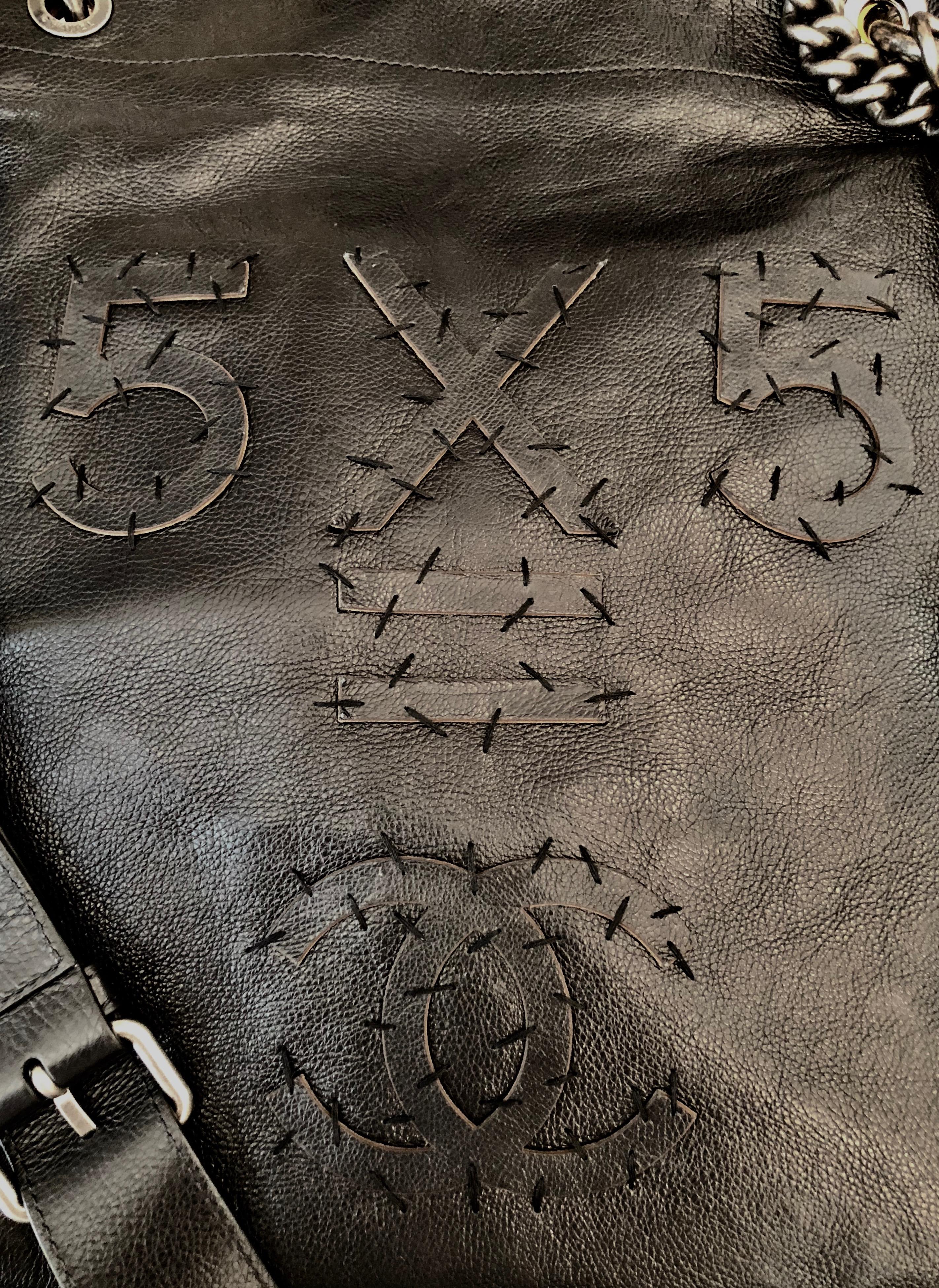 Lovely and very limited Chanel satchel from the Spring-Summer 2015 Collection. 
Trendy and stylish, it features embroided stitches reading '5x5 = CC' on one side and 