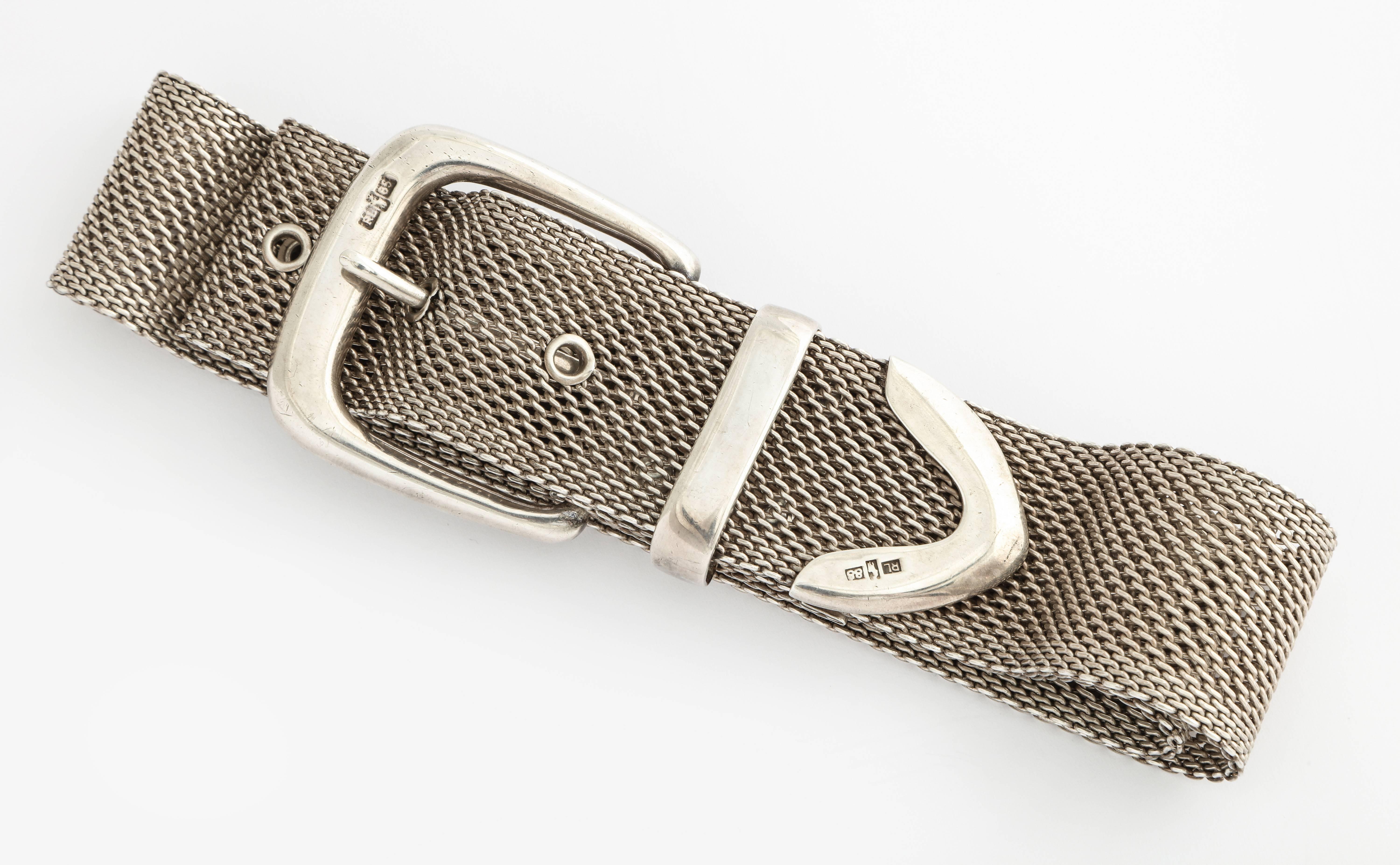 This chic and modern looking 1980s Ralph Lauren sterling silver mesh belt will work for jeans, tunic top, or dress. Total length of 33 inches, and fits a 28 inch waist; mesh width 1 1/4 inches. Signed on buckle and tip; sterling silver marks.