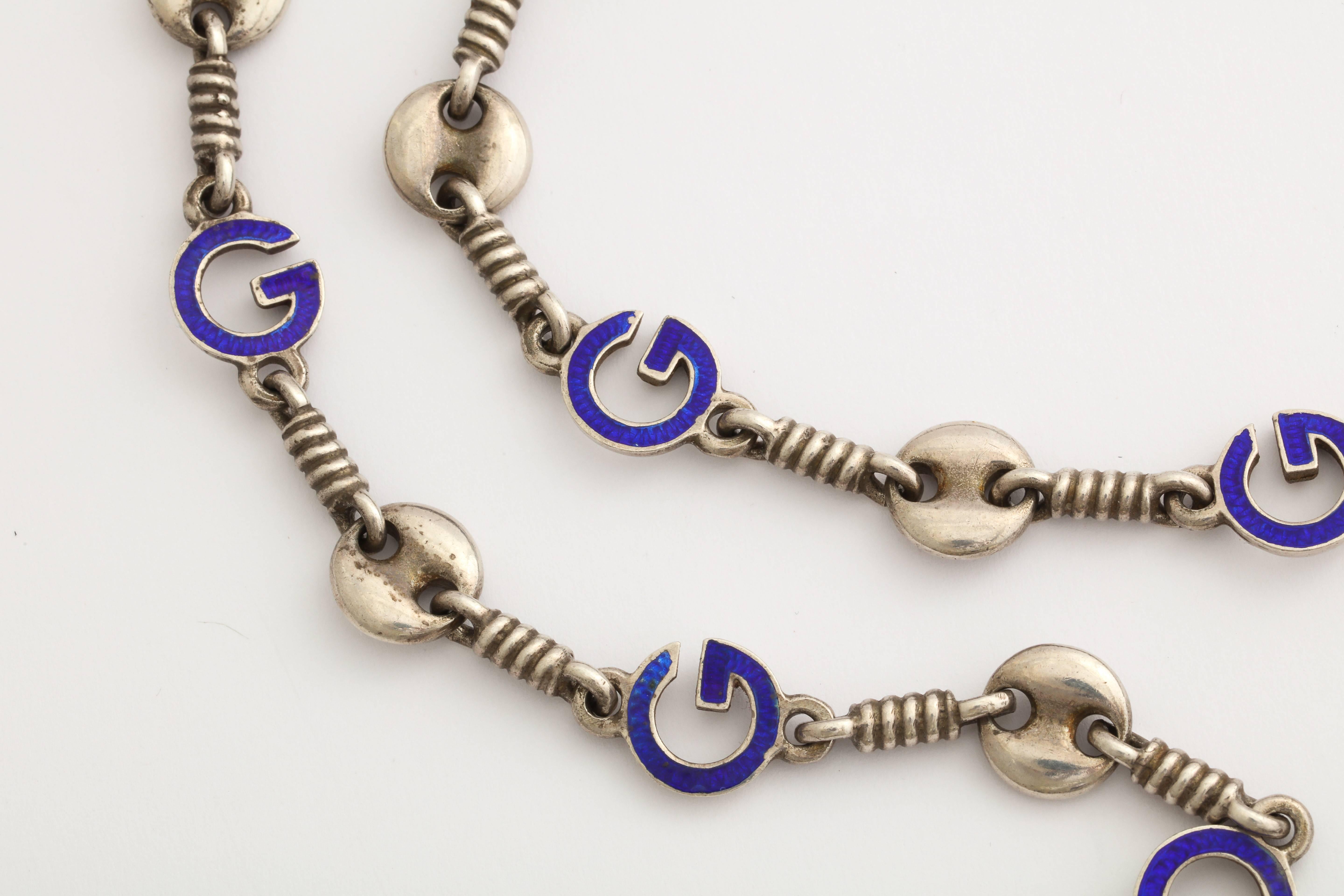 Think of Jetsetter's and Studio 54, while wearing this long chic 1970s Gucci chain of sterling silver, featuring blue enameled 