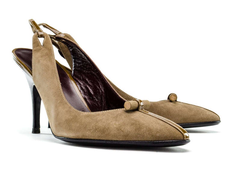 Perfect for everyday! Chanel taupe suede slingback heels are great for the office or a casual weekend retreat! These heels feature patent leather detail at the vamp, suede rolled detail, elastic slingback detail, wooden heel. Heel measures