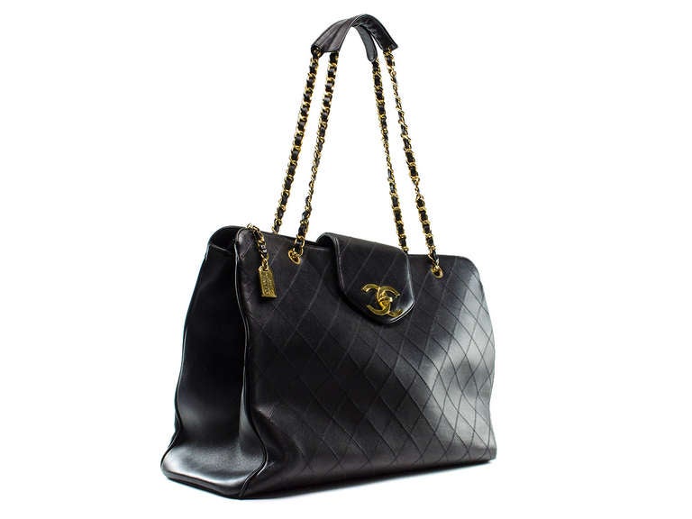 Perfect for traveling the Chanel supermodel tote says it all! This Chanel tote is featured in black lambskin leather throughout, Chanel Rue Cambon zipper pull, gold tone hardware, iconic interlocking 'CC' detail at front, three interior pockets, two