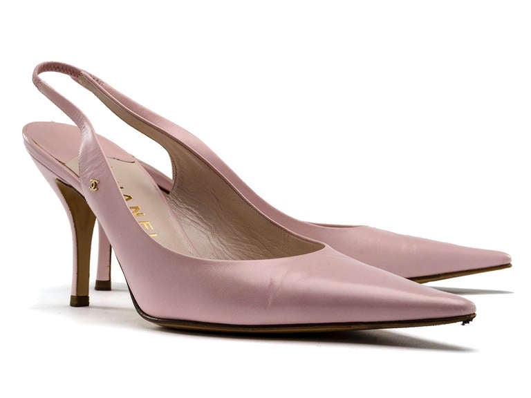 Add the perfect pastel pumps to your wardrobe with these chic Chanel heels! Featured in pastel pink leather throughout, expandable slingback, pointed toe, small interlocking 'CC' logo at side. Heel measures approximately 3.5