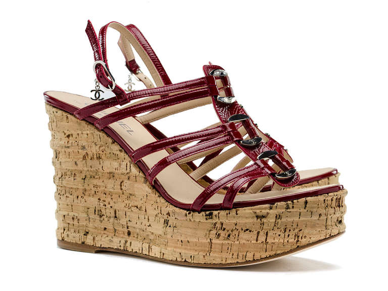 Perfect for summer! Chanel cork wedge heels with red patent leather details at front. Chanel silver tone hardware across top of the shoe. Heel measures approximately 5