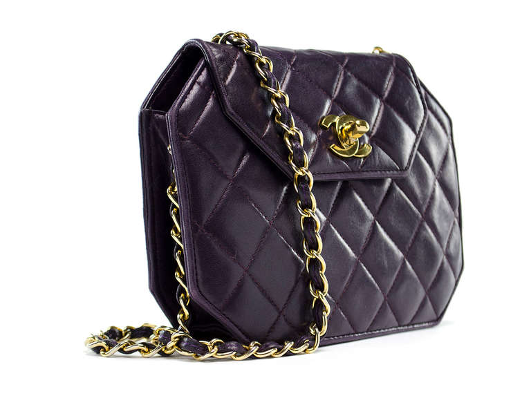 Step out in style in this unique Chanel flap! This flap is unlike any other Chanel flap with -- 8 sides! Done in gorgeous burgundy lambskin, gold tone hardware, long strap to wear as a shoulder bag or easily tucked in to be carried as a clutch.