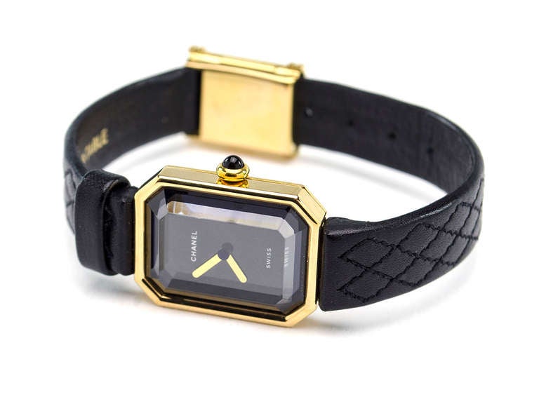 Reminiscent of a vintage Chanel perfume bottle this watch exudes timeless elegance. This watch features a black leather band with traditional quilted detailing, 18k yellow gold.

Includes: Box