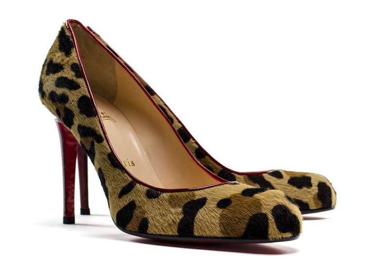 Feel unusual, sexy and wild wearing this classic Christian Louboutin heel appointed in a leopard print. Features round toe, red contrasting piping run from the vamp to arch and the back of the heel. Straight heel measures 4.5
