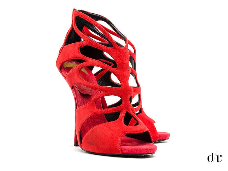 You'll be sure to have a sexy strut in these Giuseppe Zanotti sandals! These sandals are featured in red suede throughout, zip up back, open toe and 5