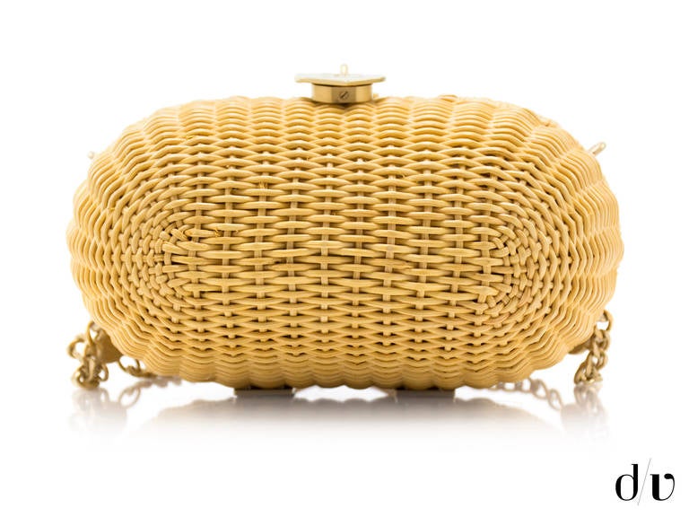 A unique & rare bag from the Chanel 2005 Cruise Collection, this bag is impossible to find! Constructed of wicker with brushed gold tone hardware throughout this is a must have for any Chanel aficionado! This bag features brushed gold tone hardware