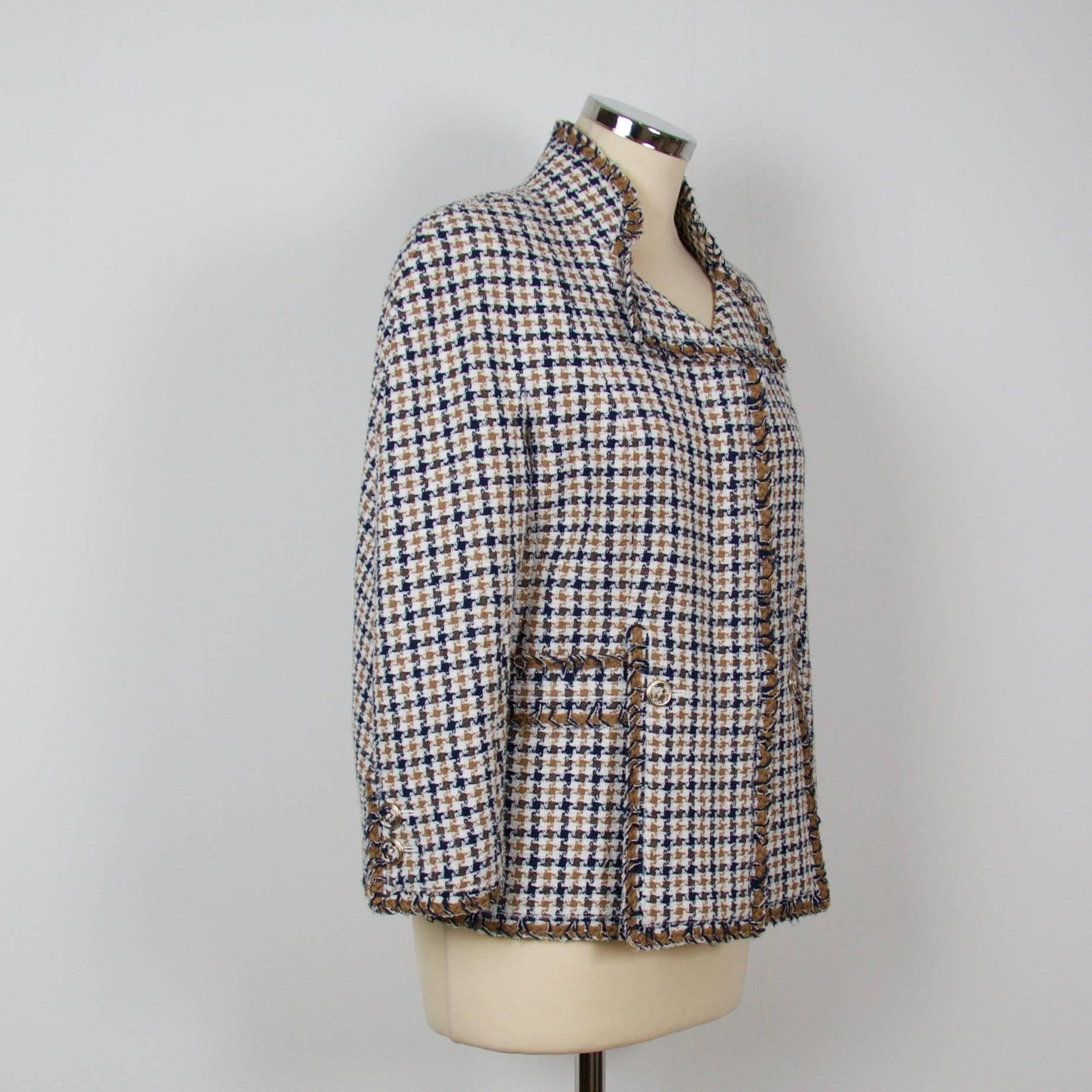 Chanel Jacket
Spring 2008
Size: French 42

33% Polyester
30% Rayon
17% Wool
10% Cotton
10% Acrylic
with a silk, spandex lining