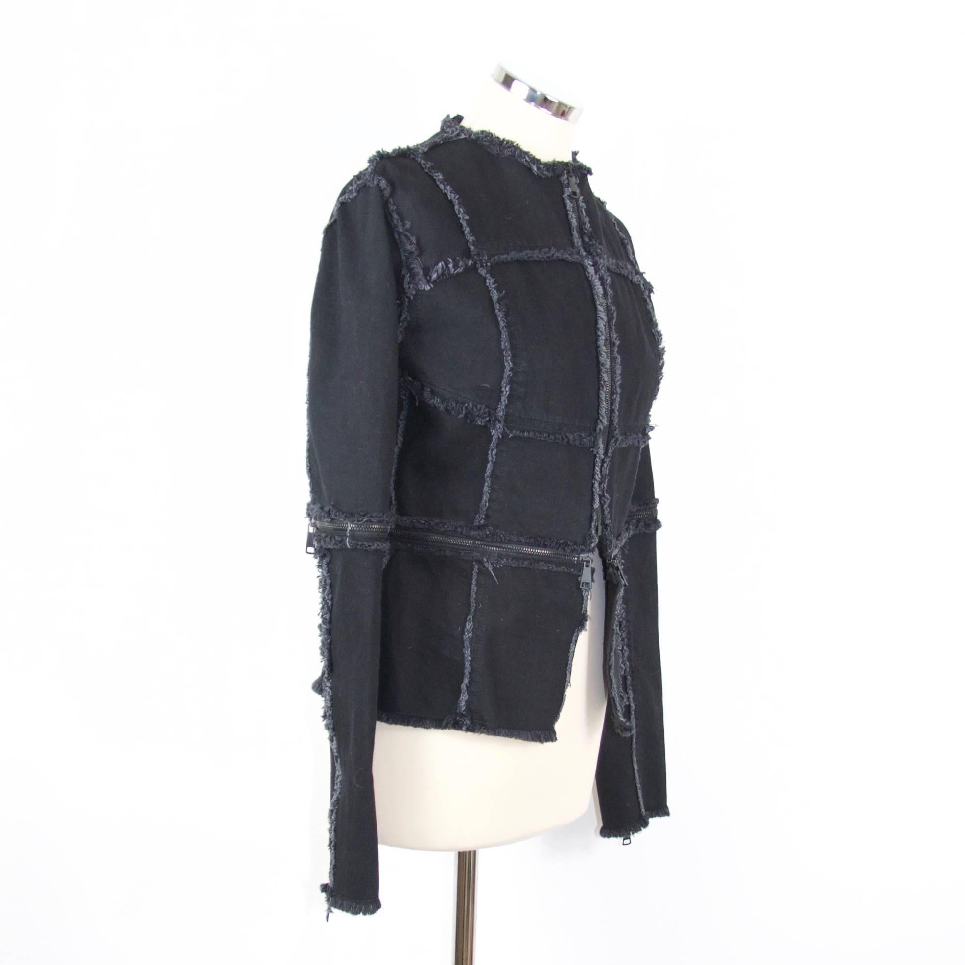Christopher Kane

Black cotton drill panel jacket with zip detail. 