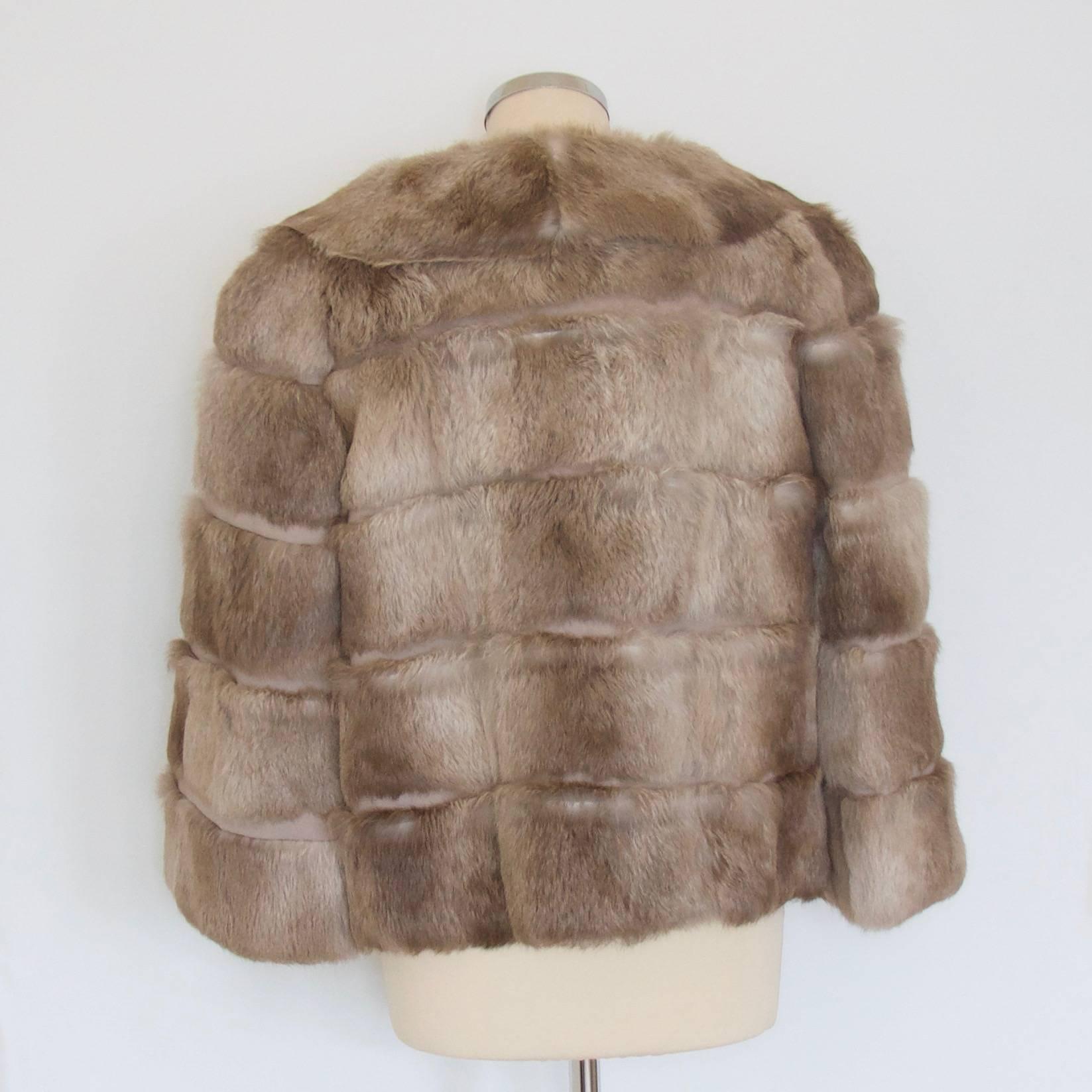 Anya Hindmarch fur coat

Inside hidden lipstick pouch
 
Made in France