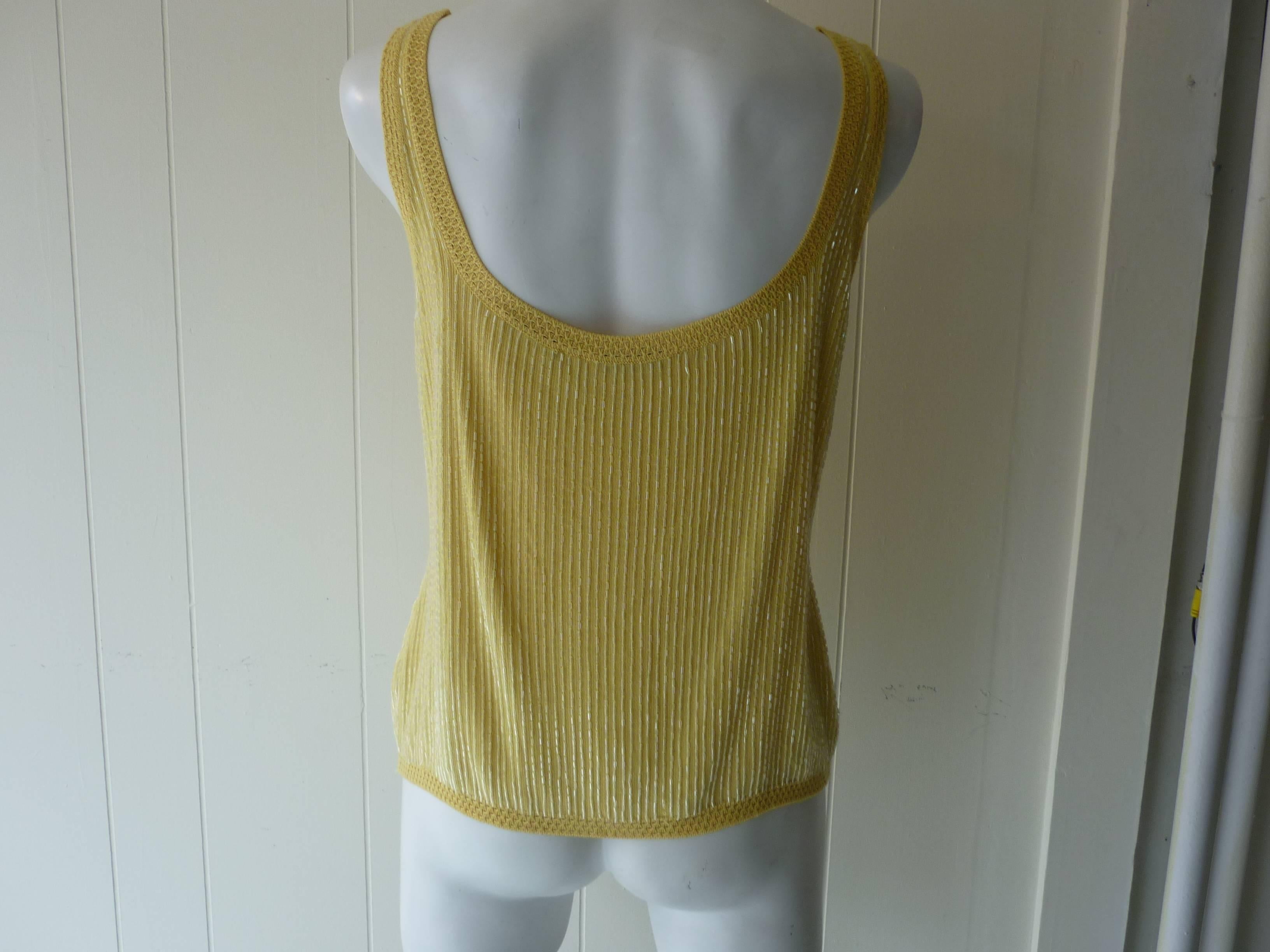 Rows of beads cover this yellow top which is trimmed with delicate open cotton weave.

Made in Italy

21%WS
21%SE
18%WO
40%VI