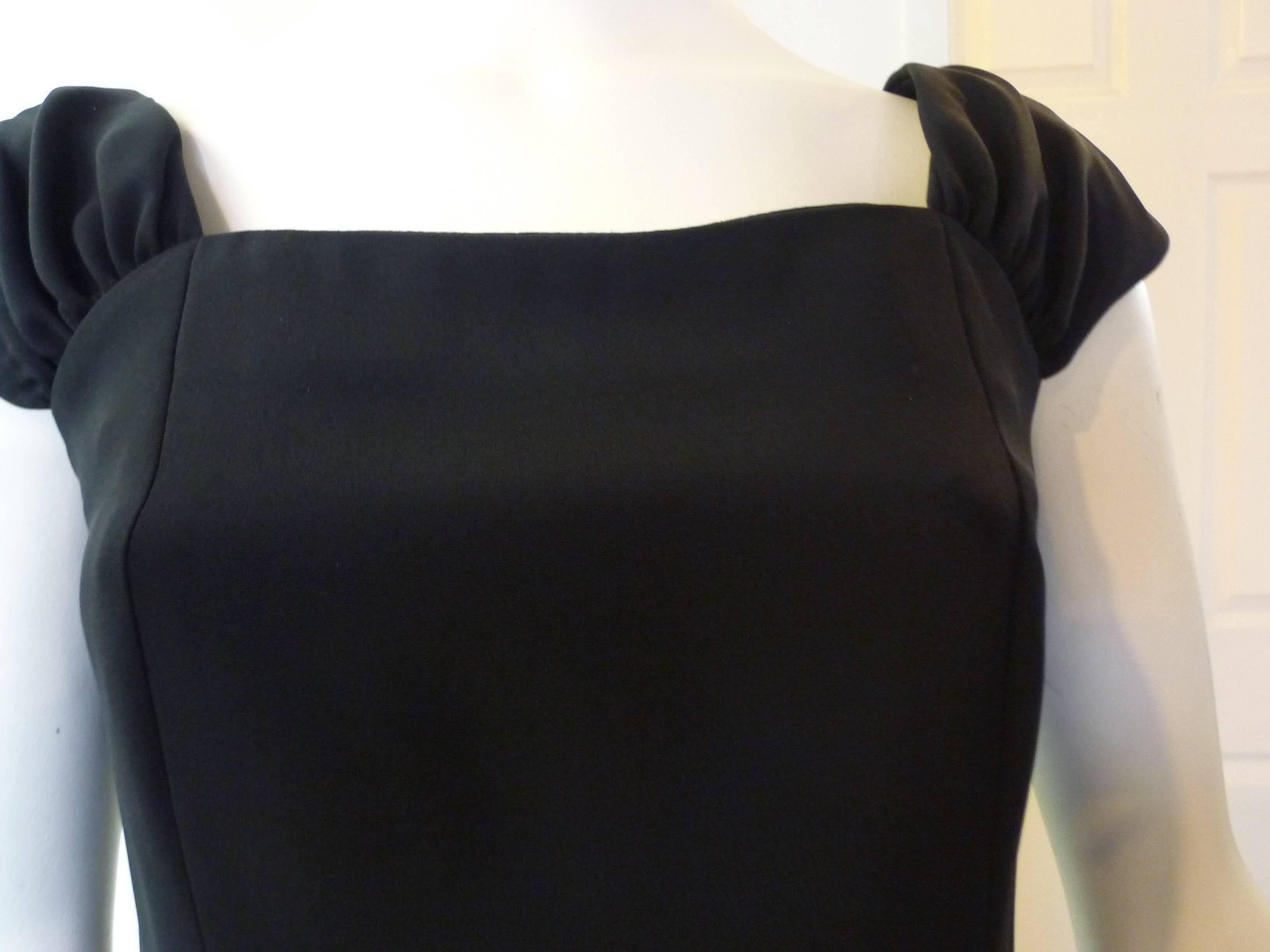 Very simple tailored dress made of a rayon blend, with nice wide draped shoulder straps and discreet neckline.